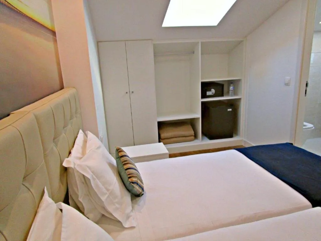 Bed in Lisbon City Apartments & Suites by City Hotels