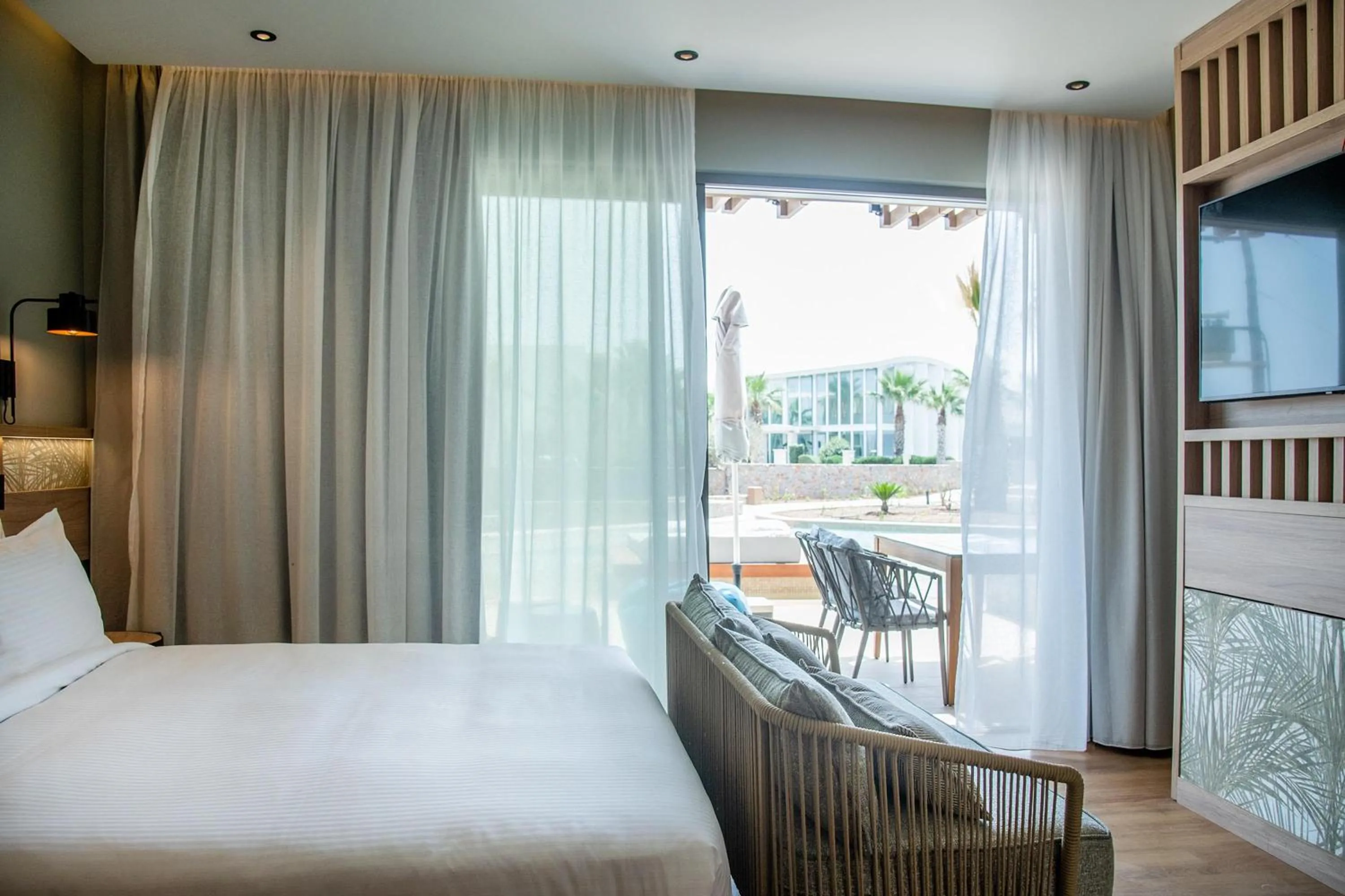 Photo of the whole room, Bed in SENSEANA Sea Side Resort & Aquadventure