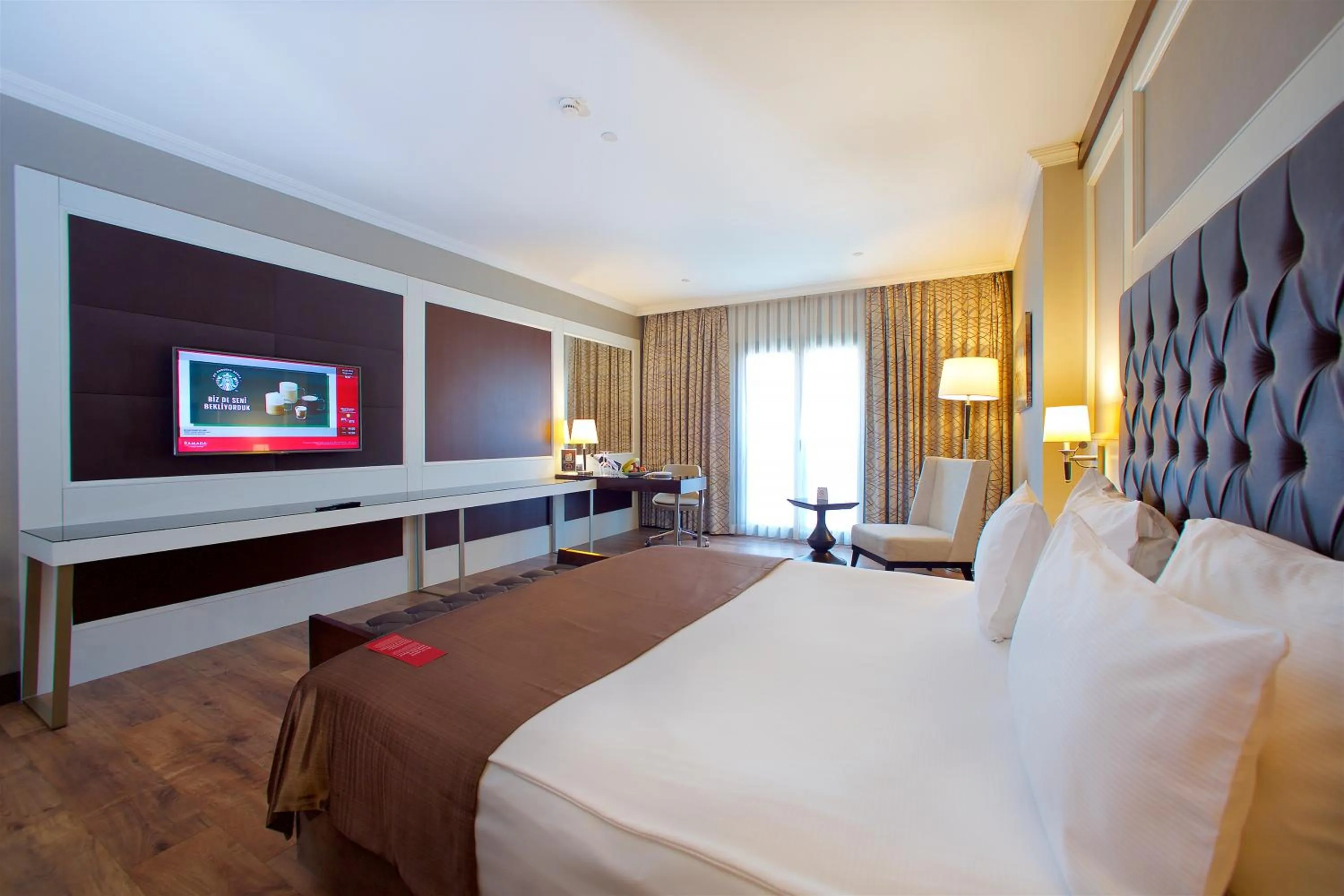 Communal lounge/ TV room, Bed in Ramada by Wyndham Istanbul Merter