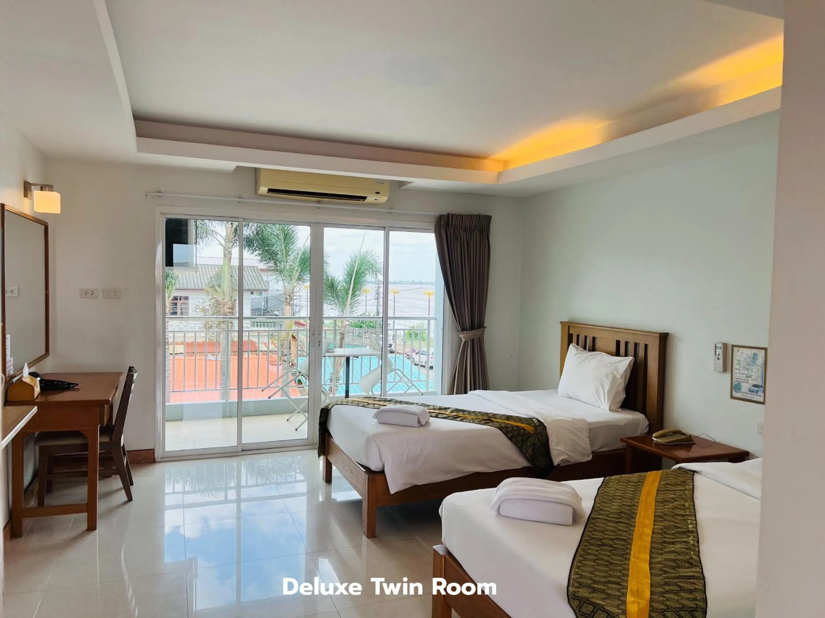 Bed in That Phanom River View Hotel