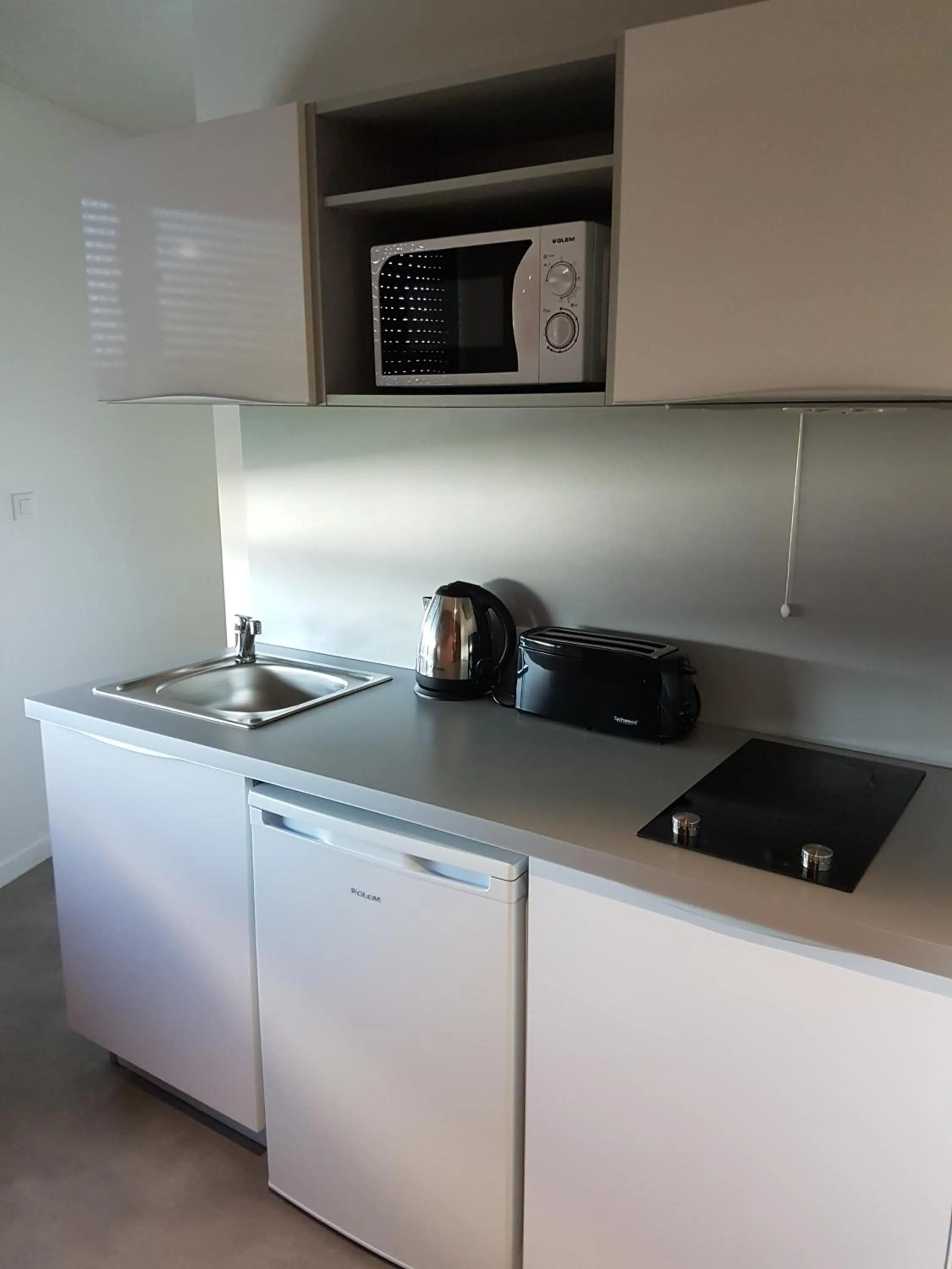 Kitchen or kitchenette in All Suites Appart Hôtel - Bordeaux - Pessac