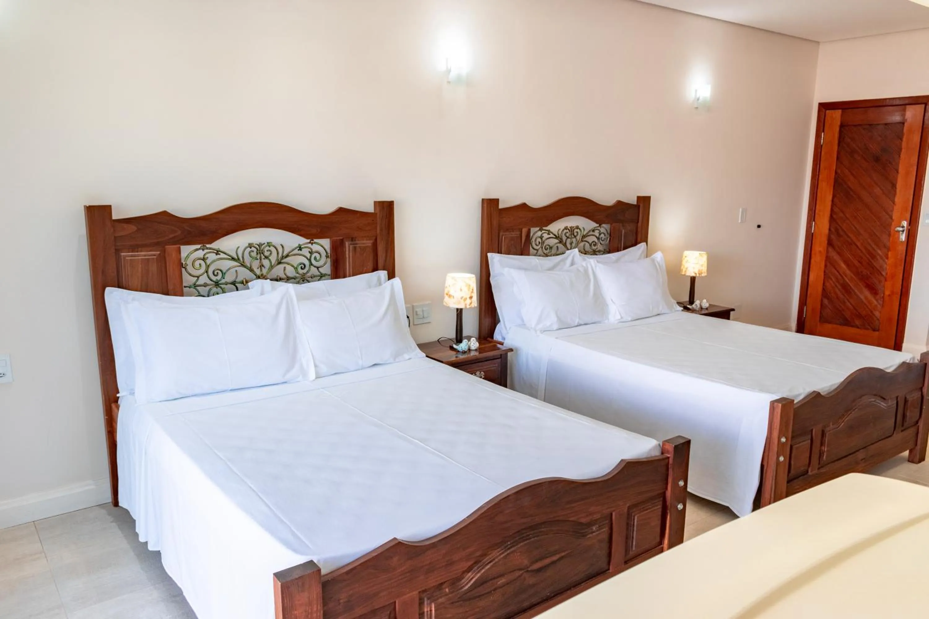 Bed in BellaMinas Pousada