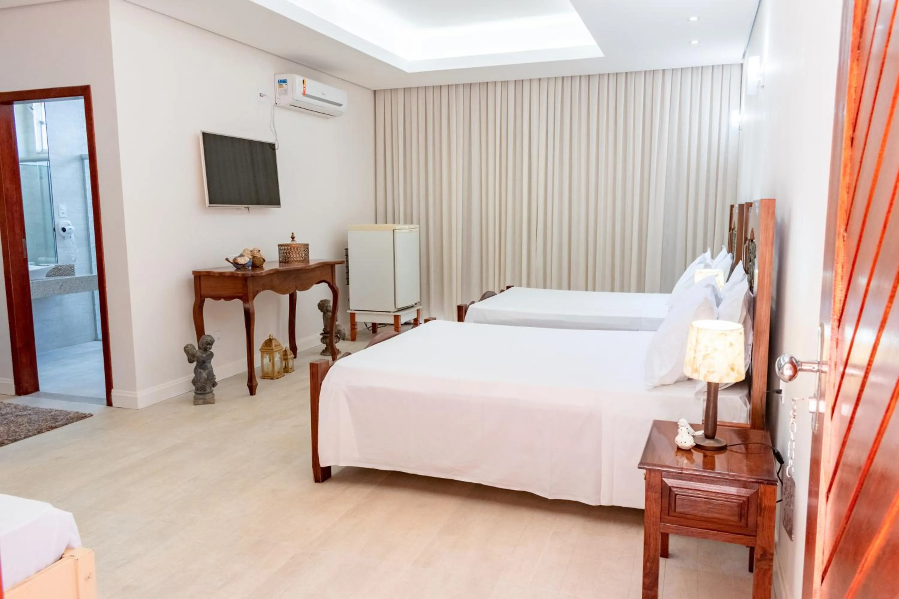 Bed in BellaMinas Pousada