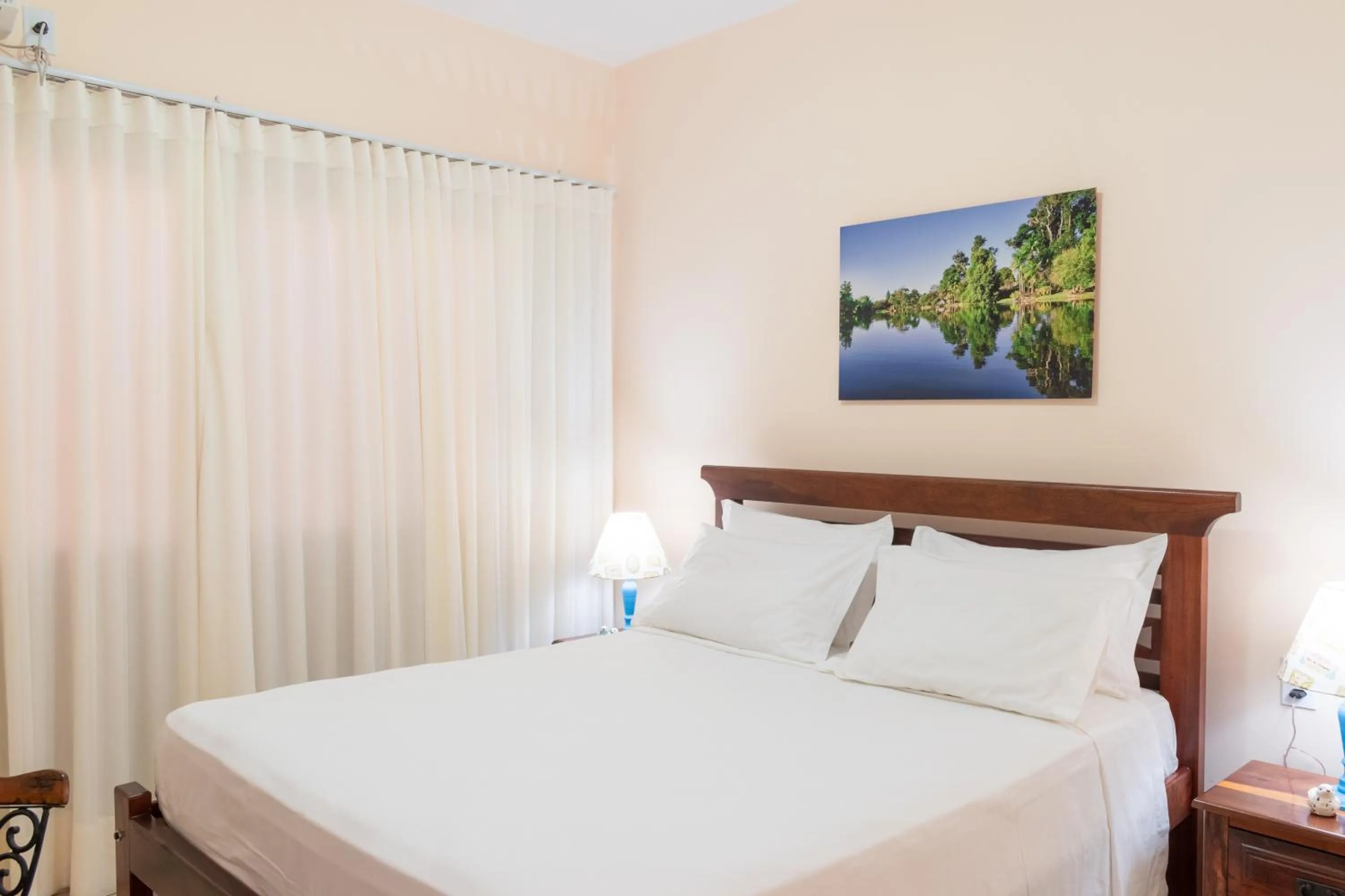 Bed in BellaMinas Pousada