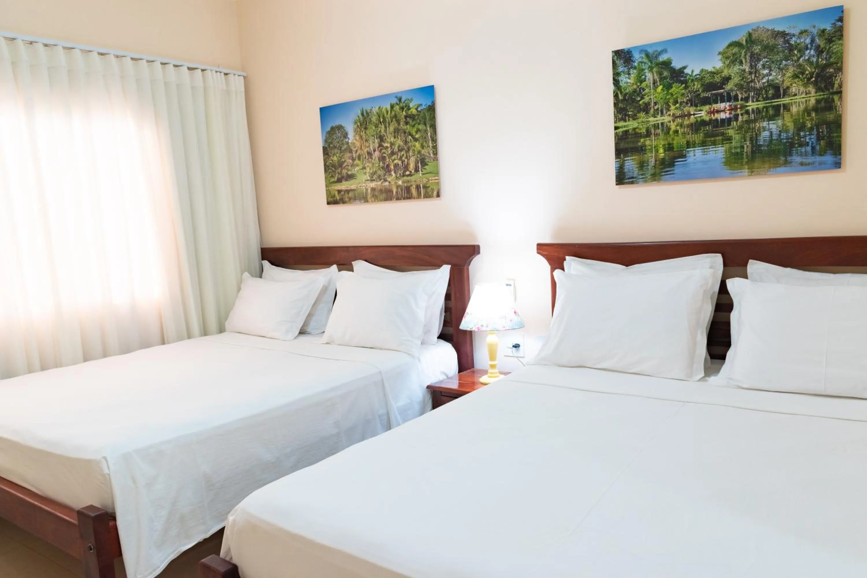 Bed in BellaMinas Pousada