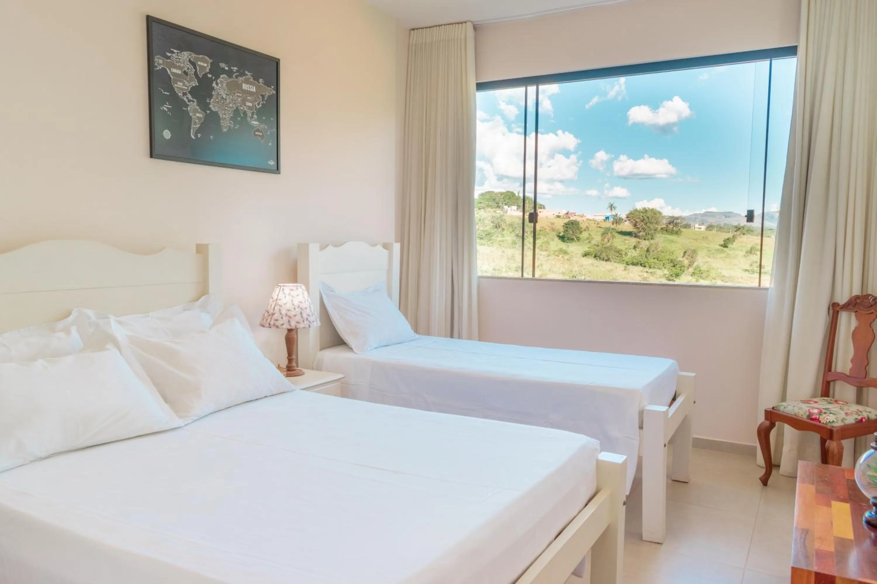 Bed in BellaMinas Pousada