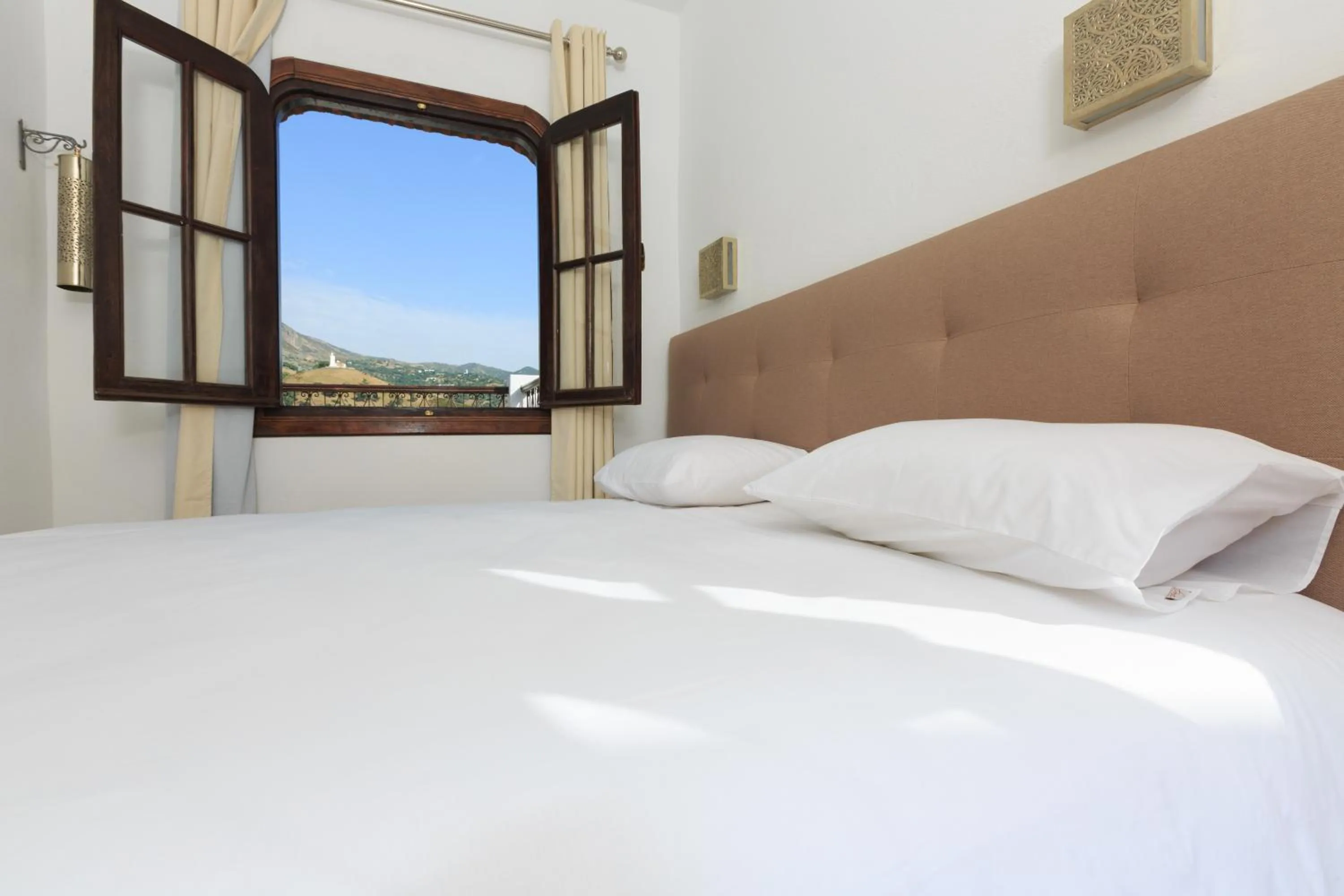 Bed in Riad Zaitouna Chaouen