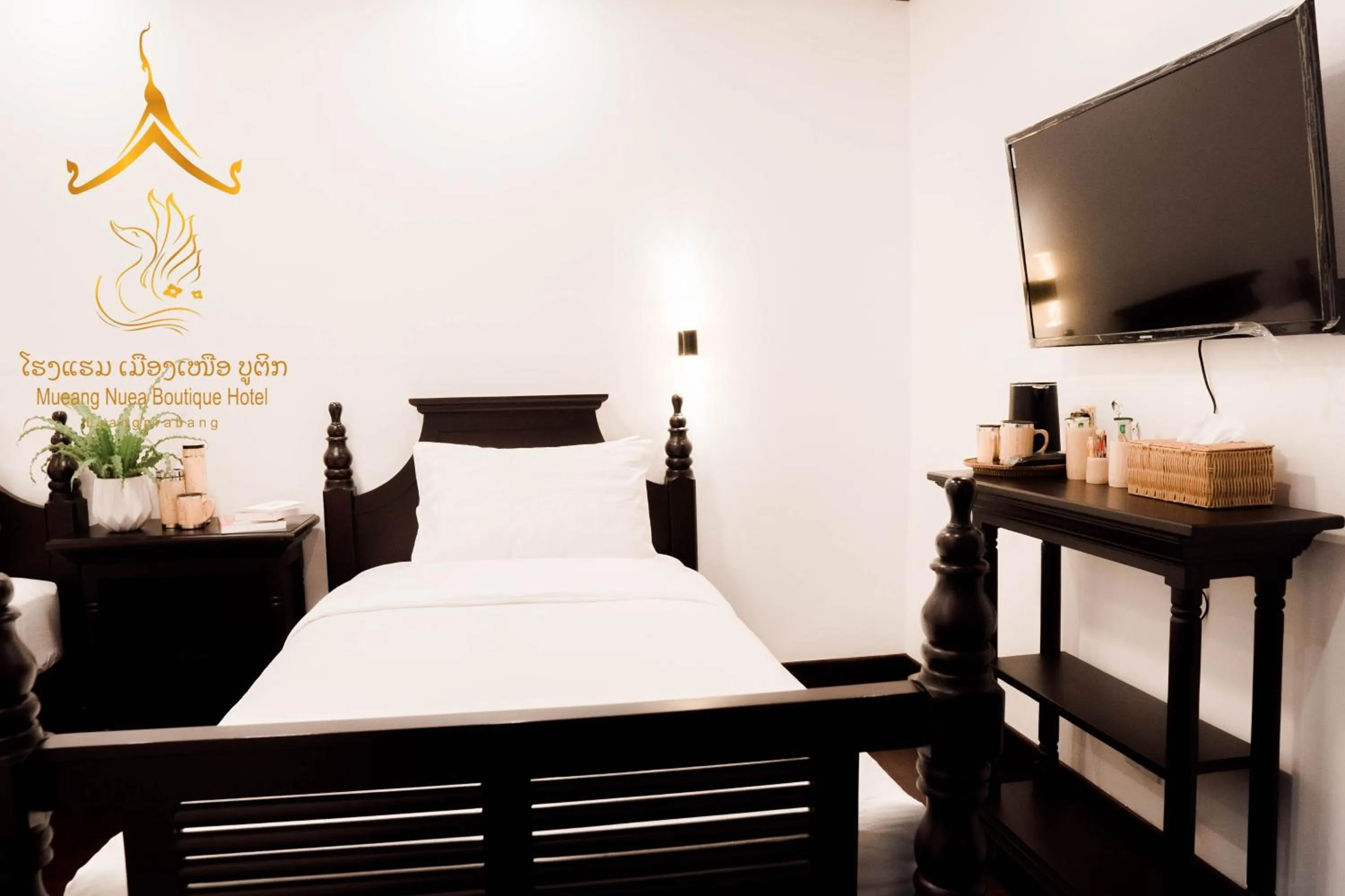 Bed in Mueang Nuea Boutique Hotel