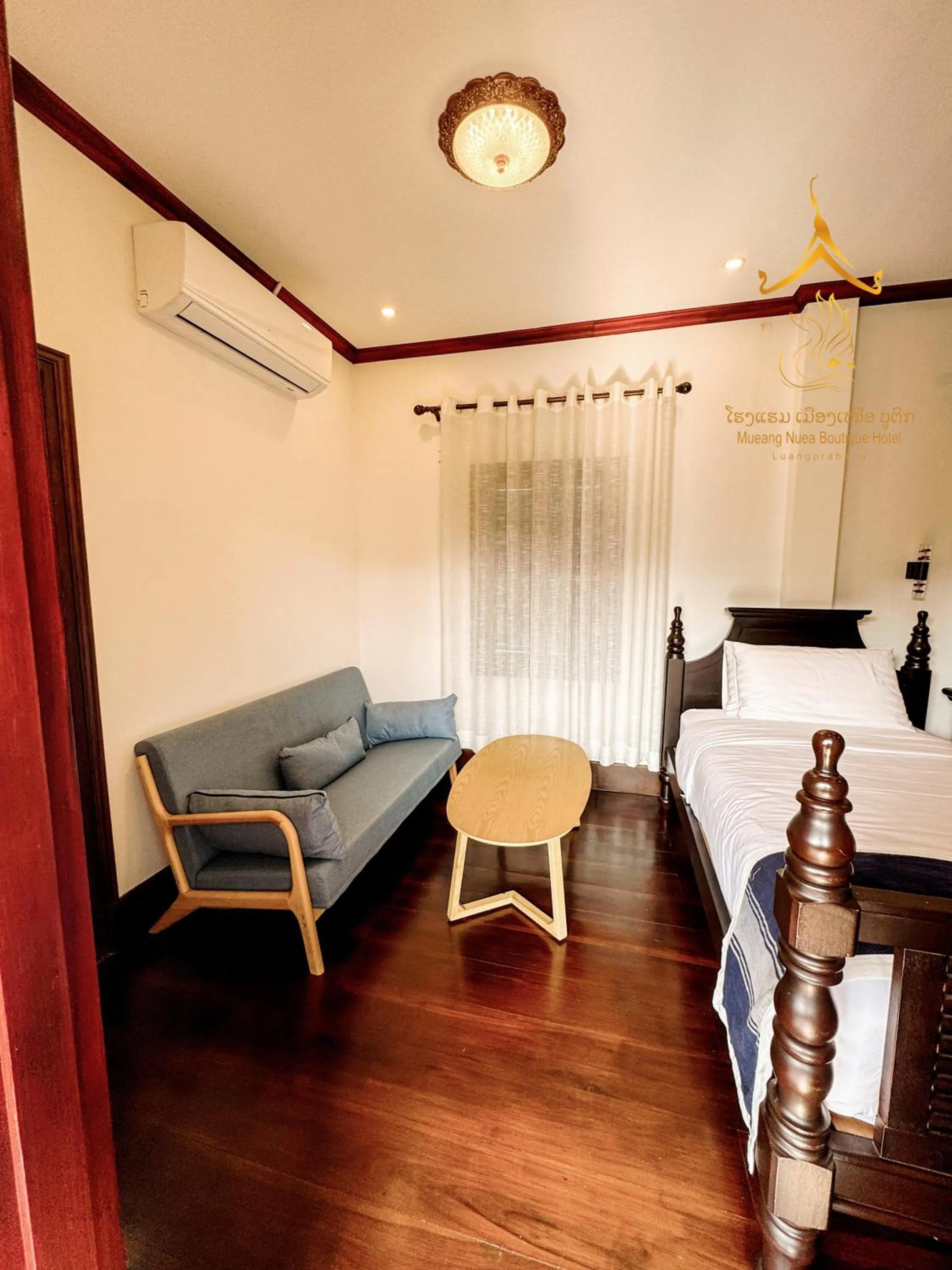 Seating area, Bed in Mueang Nuea Boutique Hotel