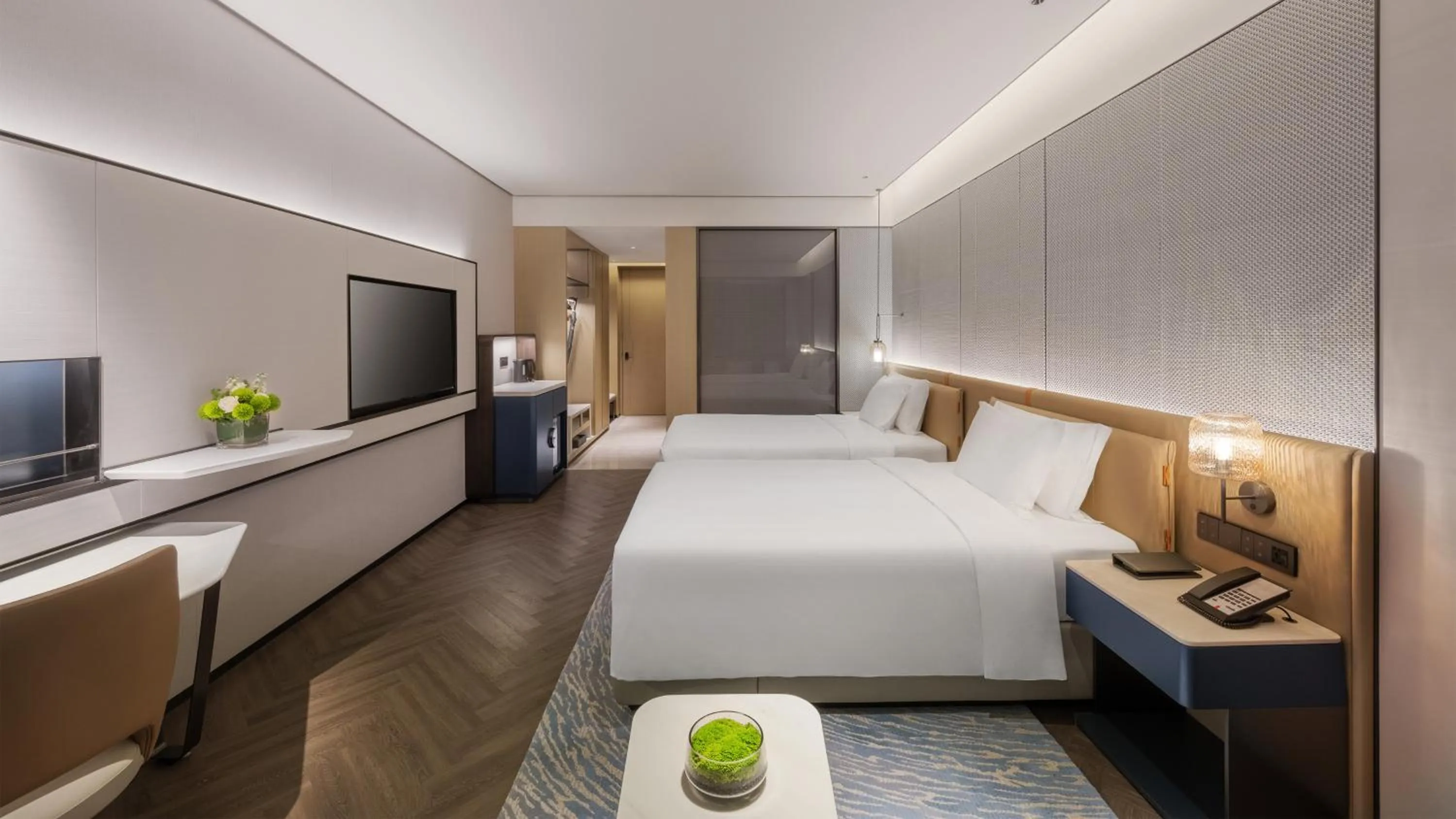 Seating area, Bed in Crowne Plaza Weihai Binhai by IHG