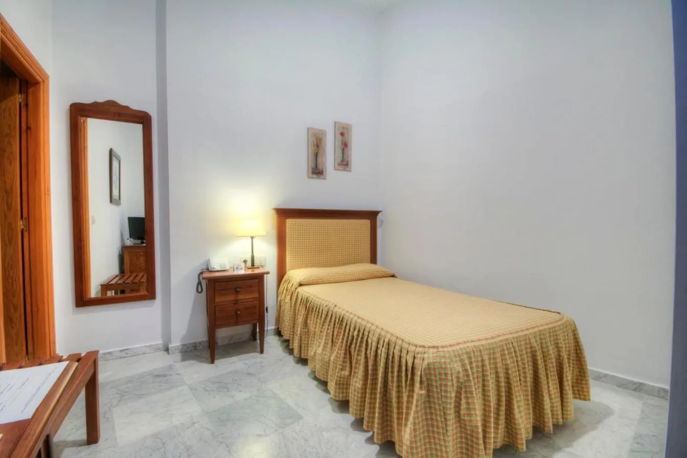 Bed in Hotel Tugasa Casa Palacio Medina Sidonia