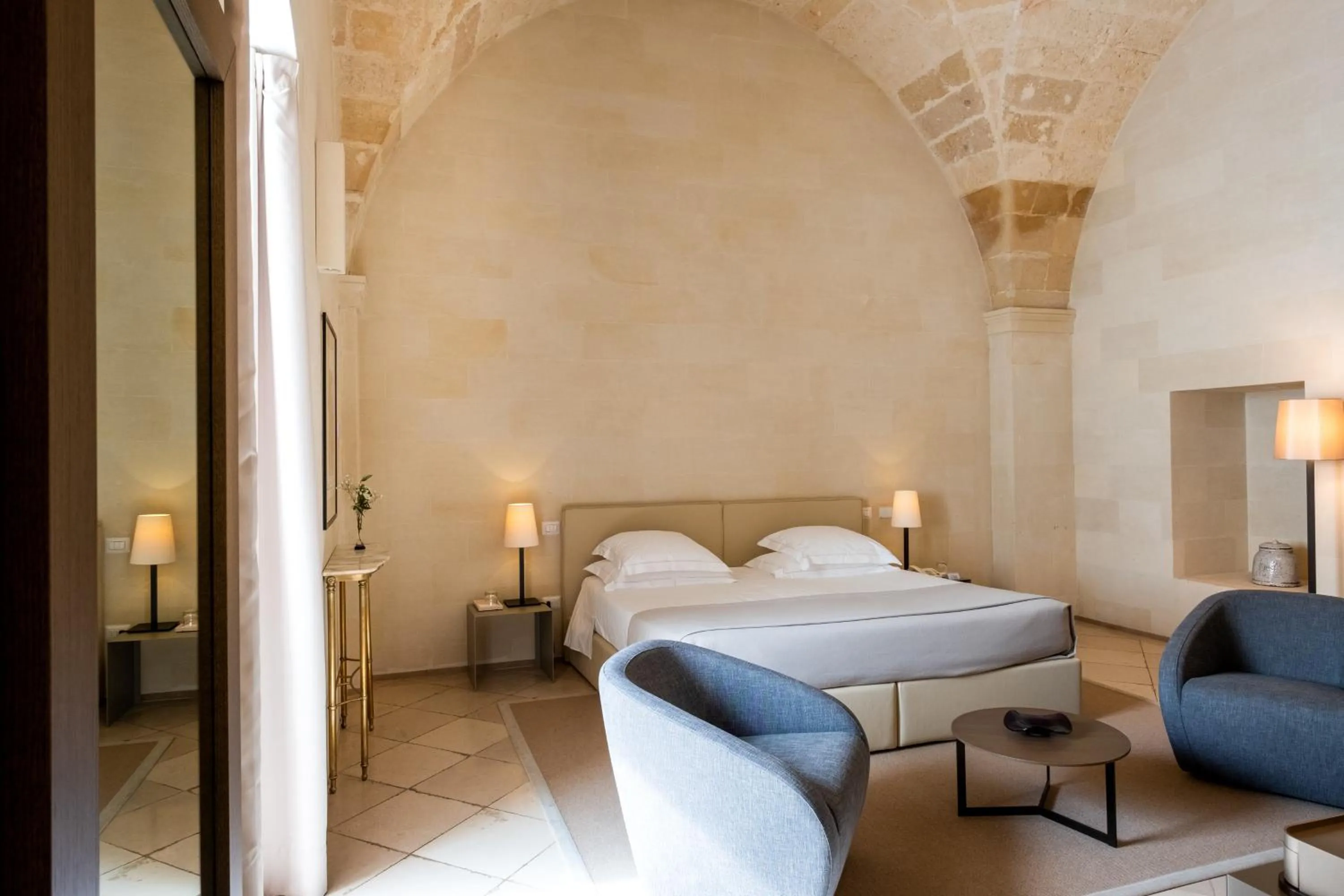 Bed in La Fiermontina Luxury Home Hotel