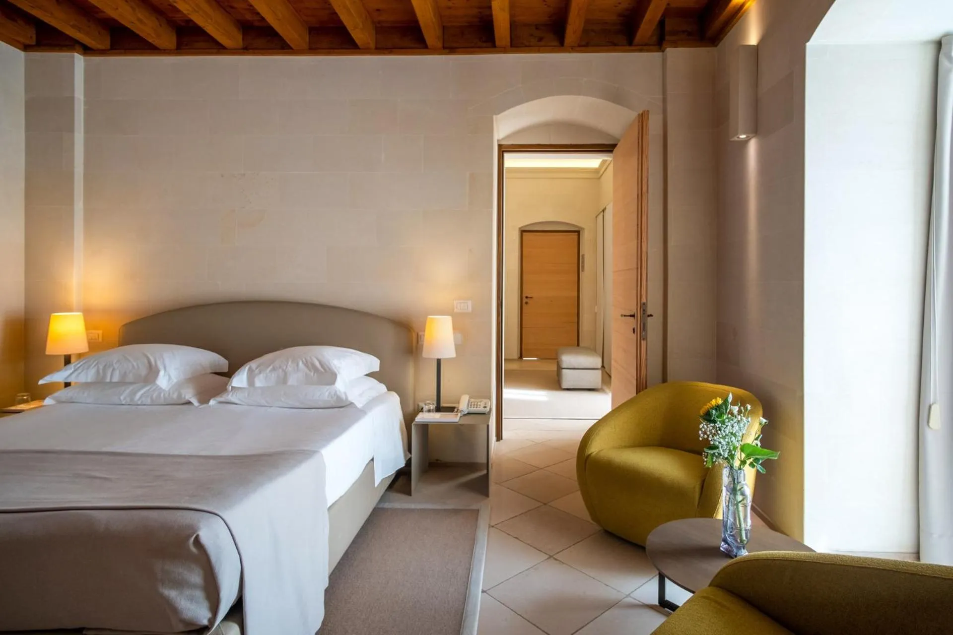 Bed in La Fiermontina Luxury Home Hotel