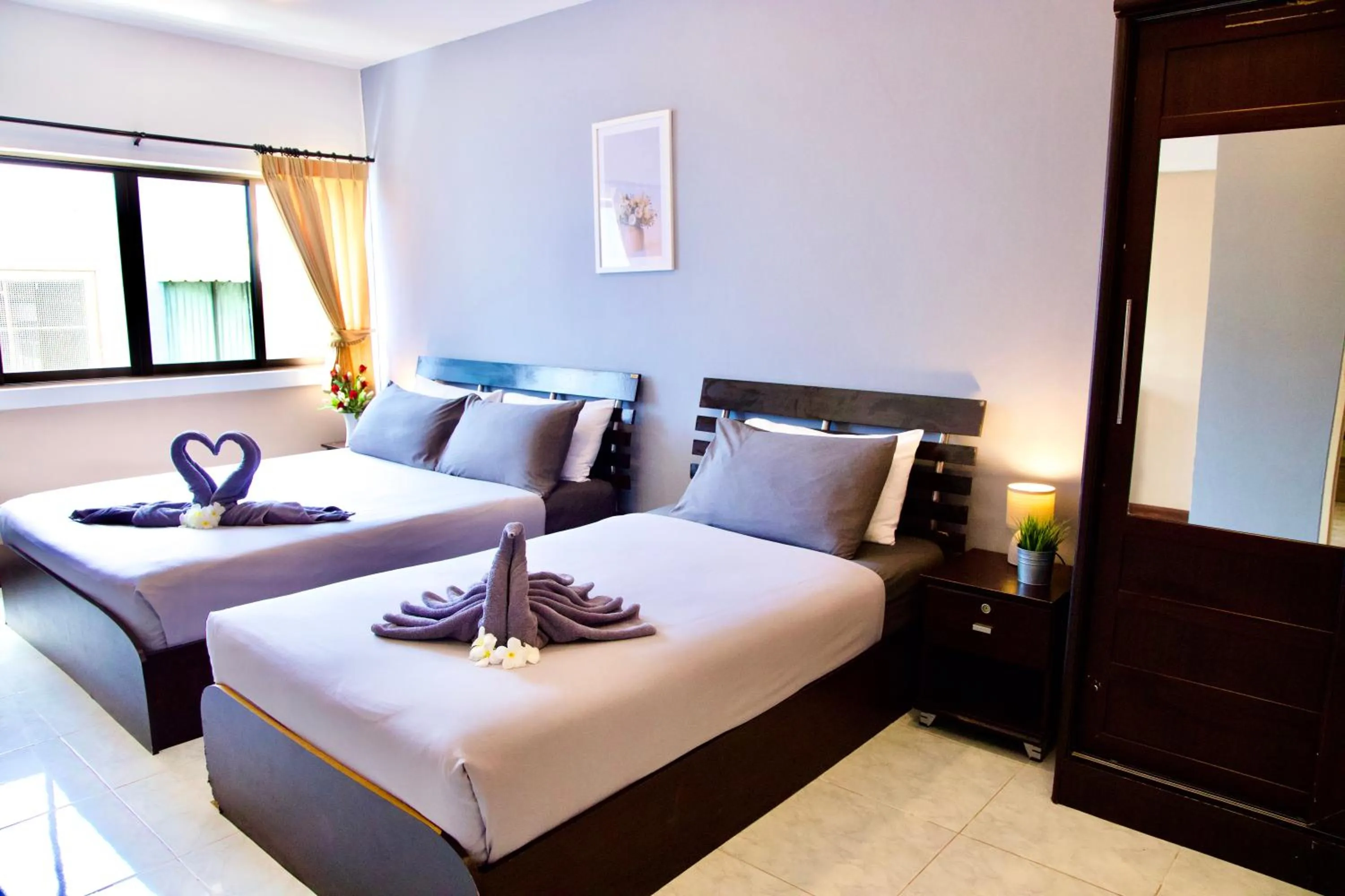 Photo of the whole room, Bed in GOLDEN GUESTHOUSE by The Beach Cha Am