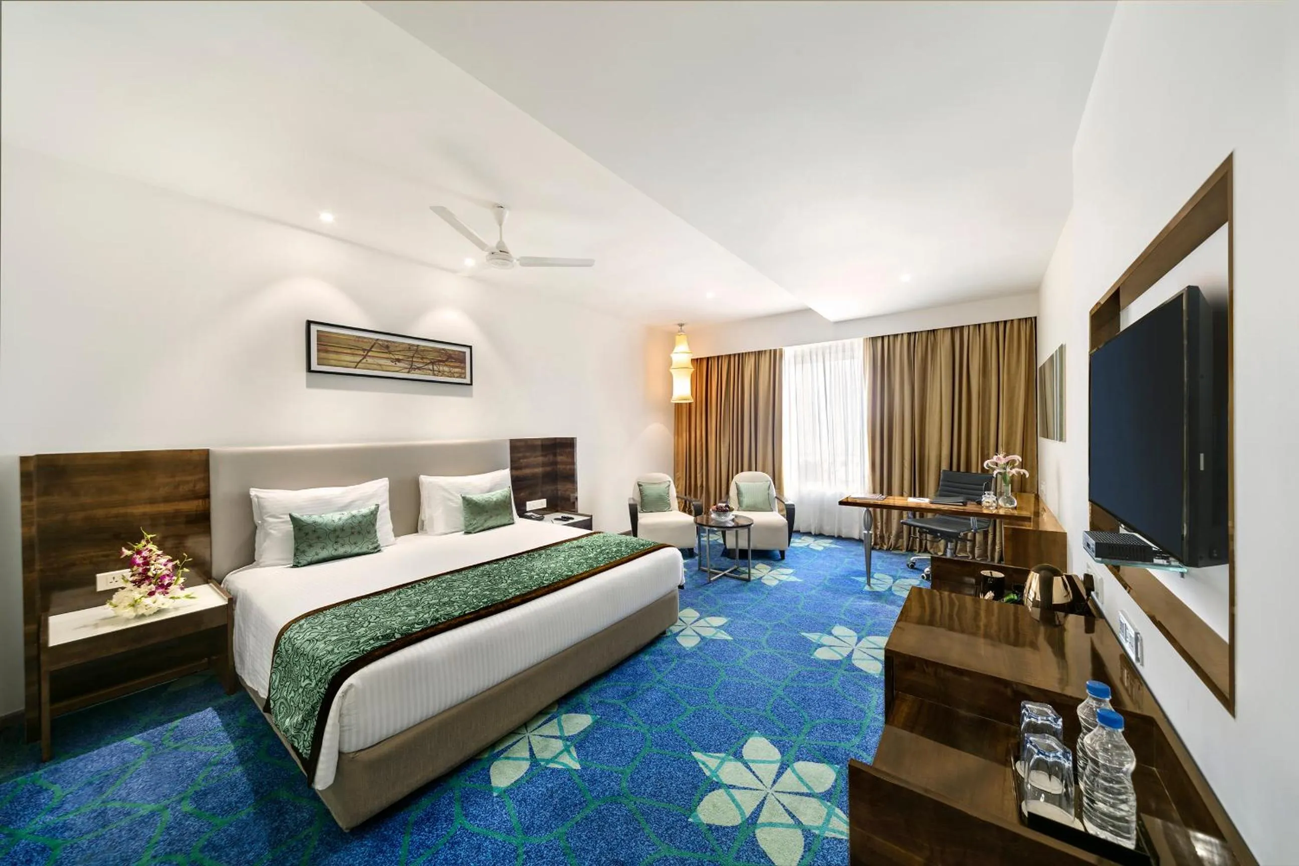 Photo of the whole room, Bed in Grand Kakinada by GRT Hotels