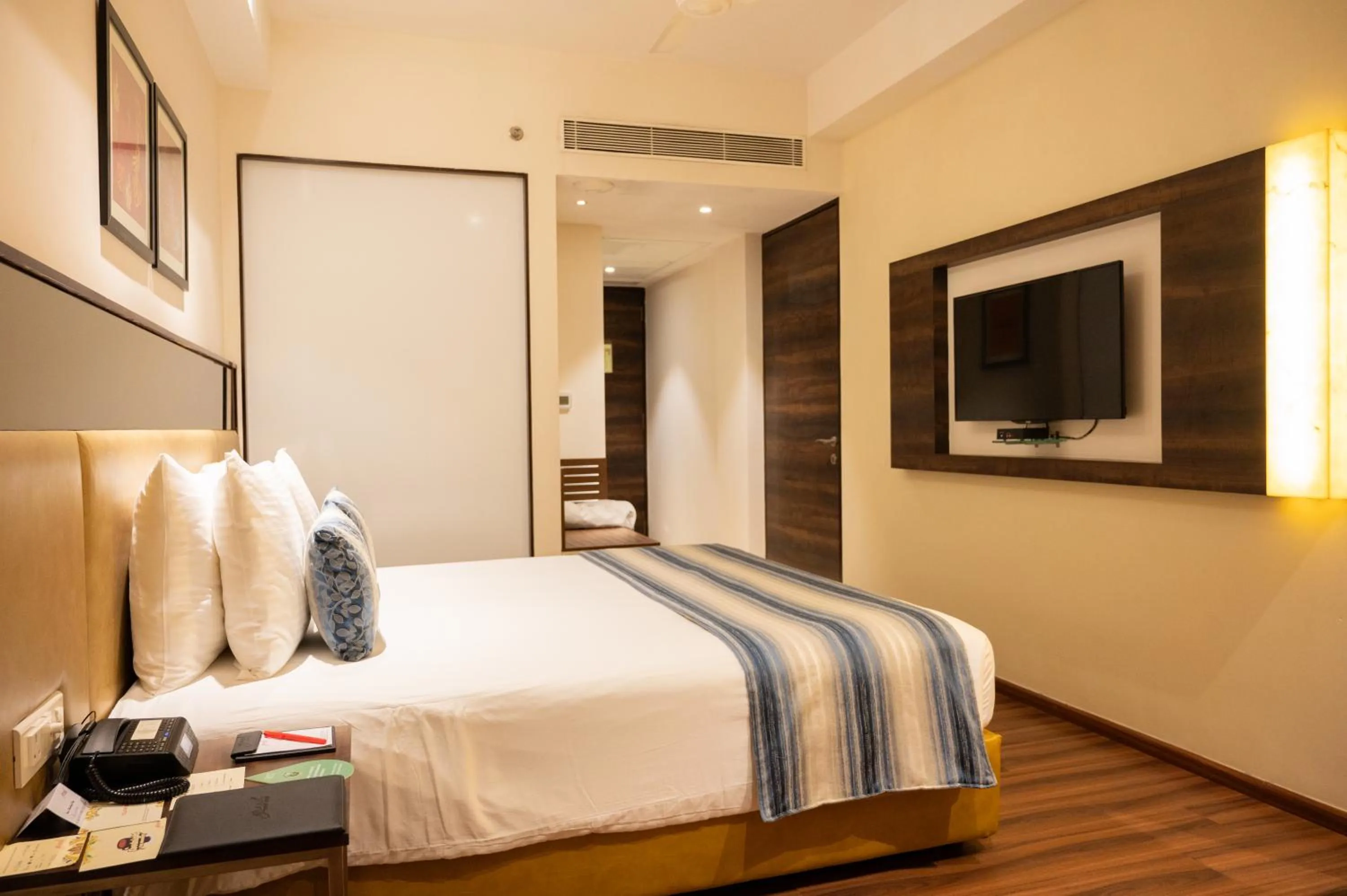 Bed in Grand Kakinada by GRT Hotels