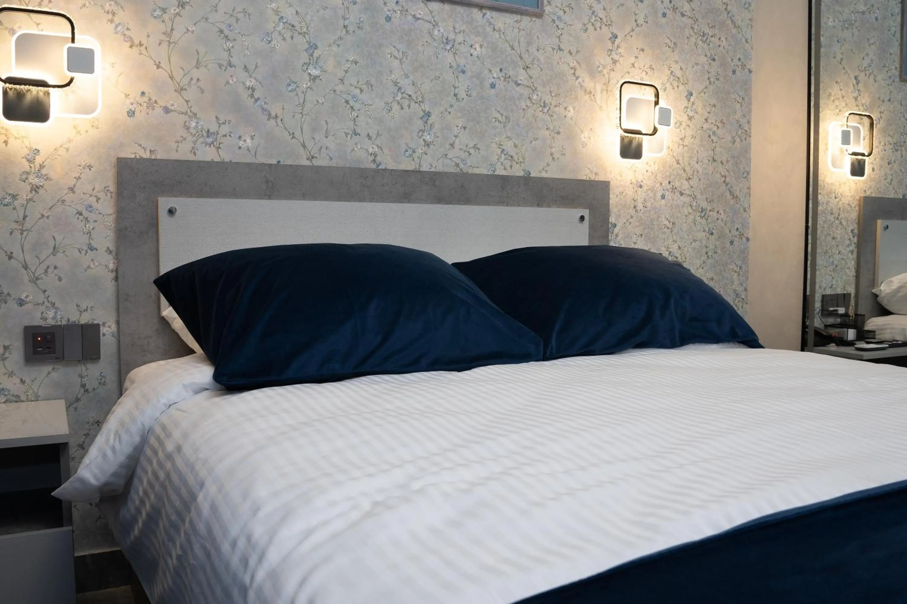 Bed in Prime Suites Hotel