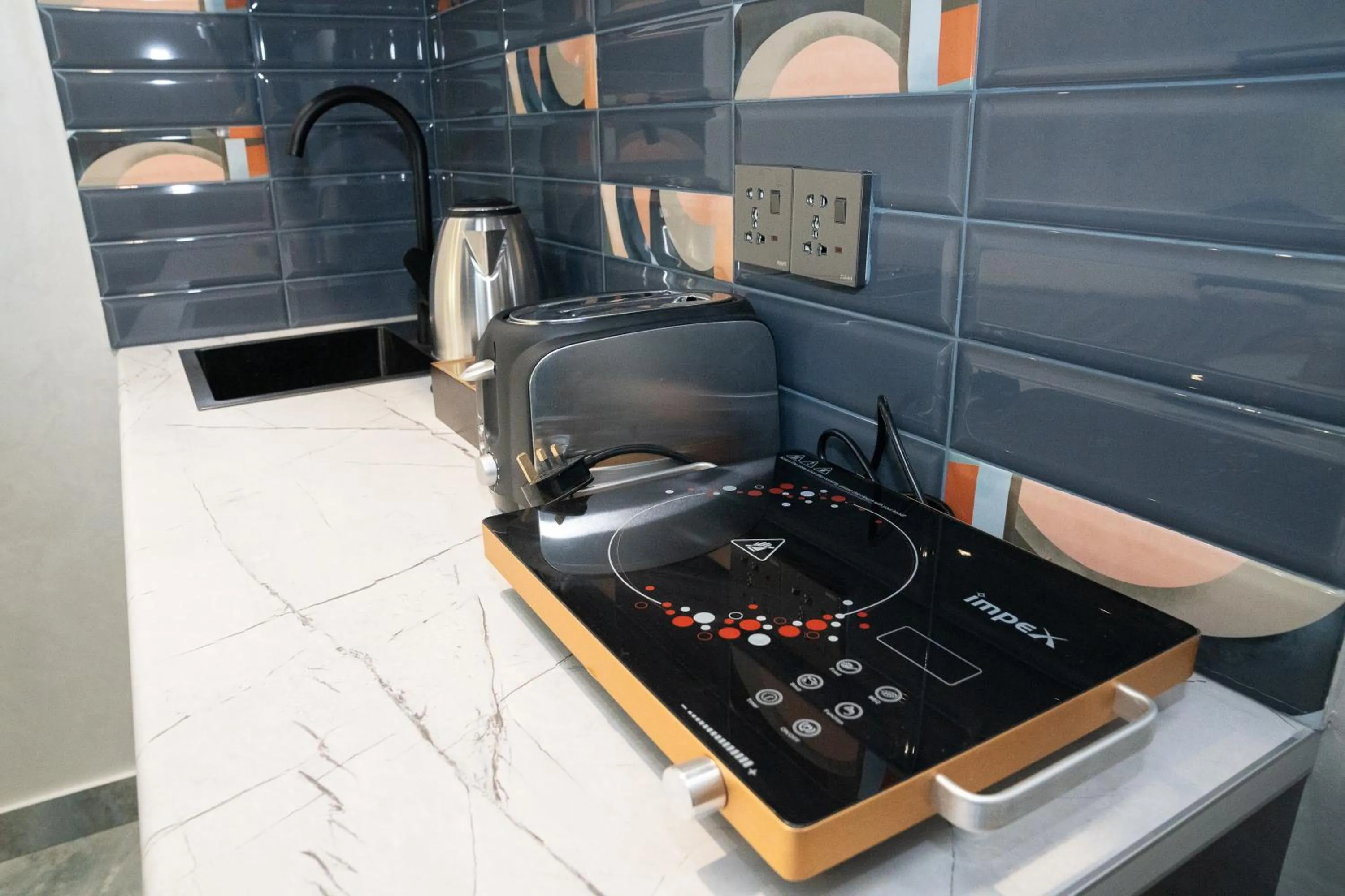 Kitchen or kitchenette in Prime Suites Hotel