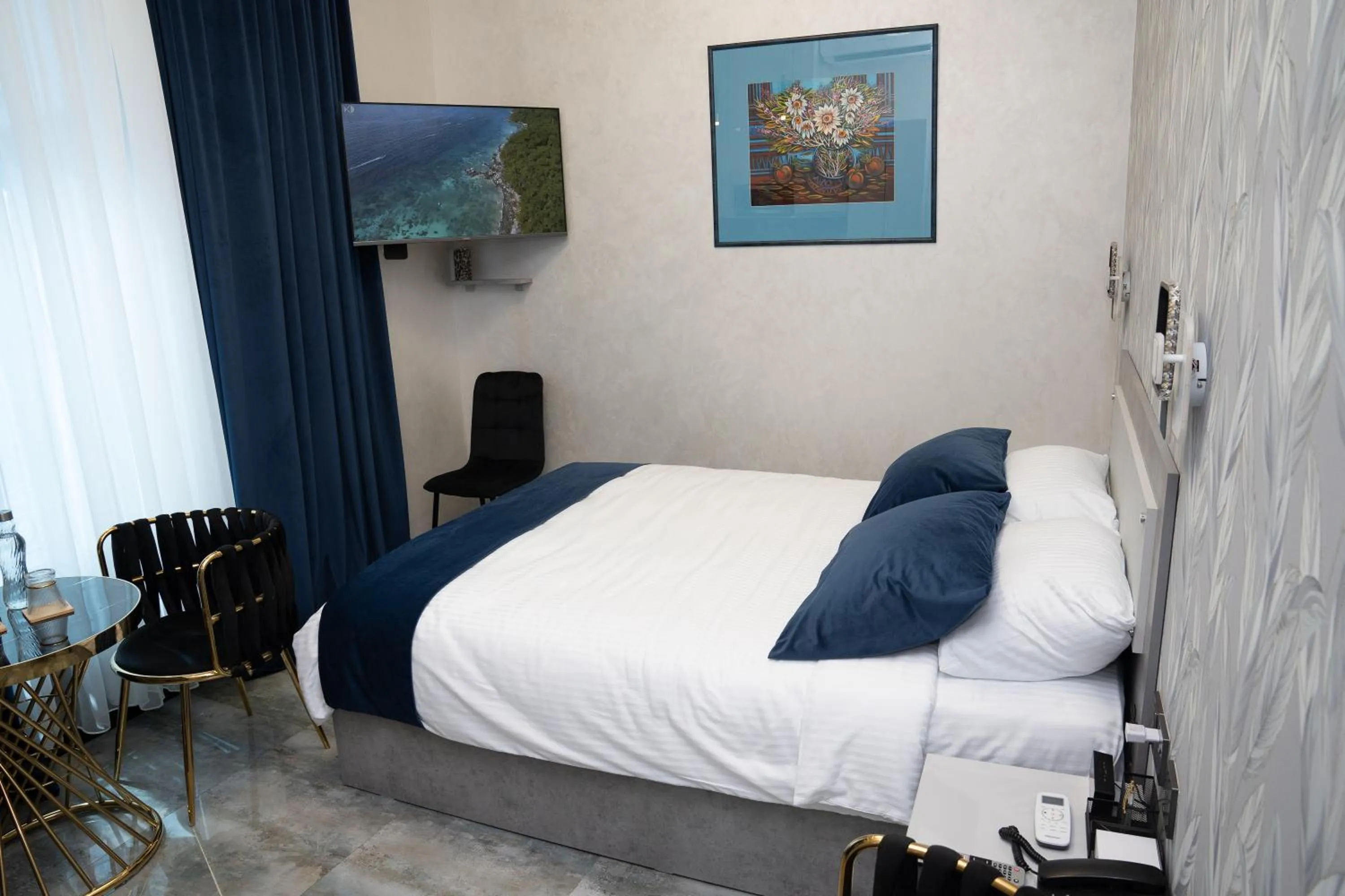 Bed in Prime Suites Hotel