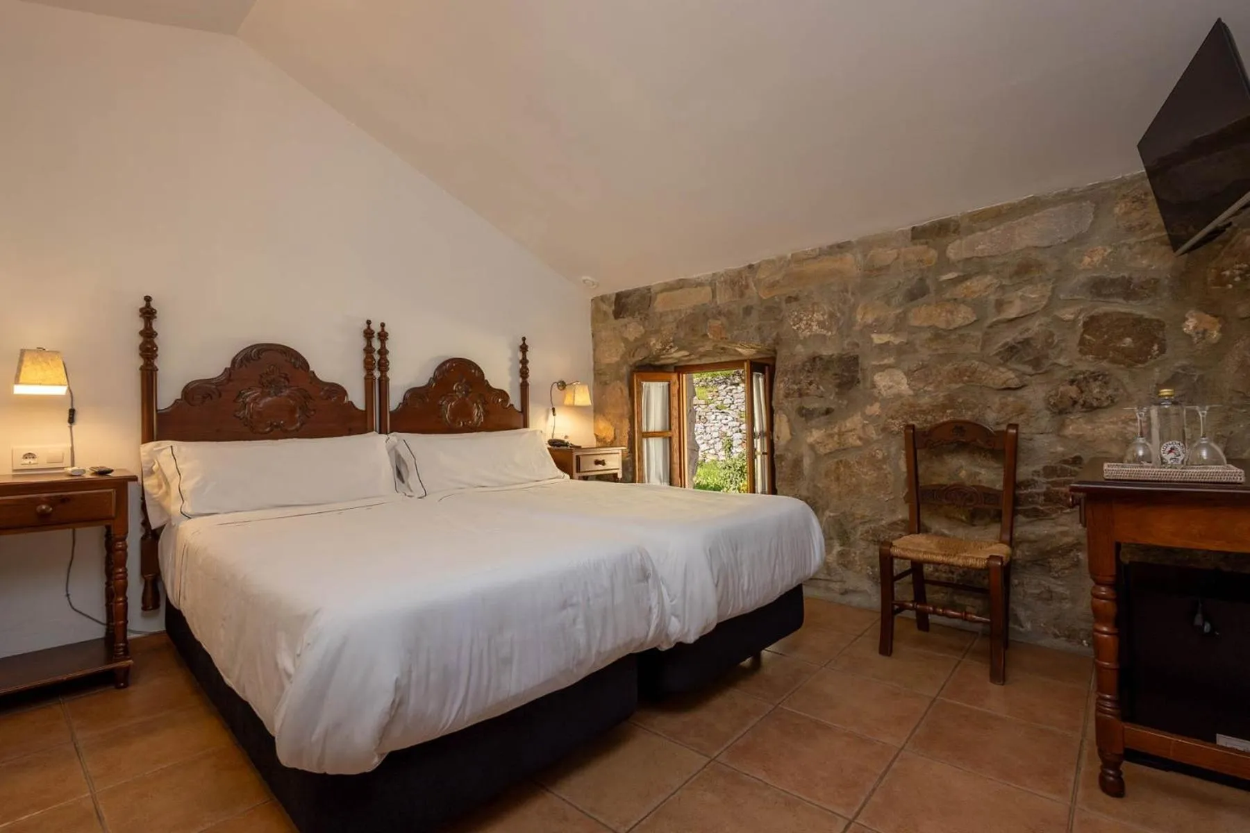 Bed in Tugasa Hotel y Apartamentos rurales La Posada