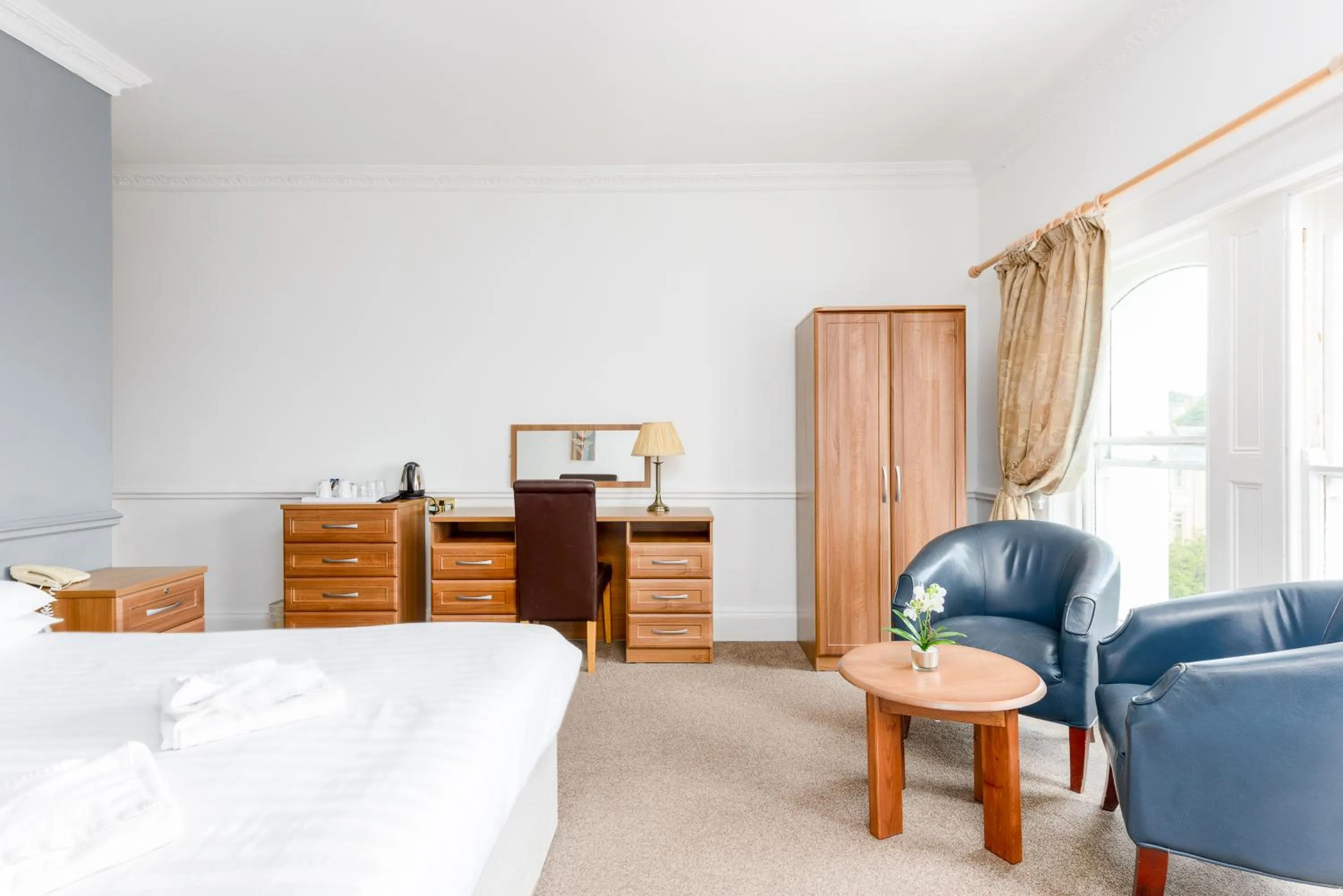 Bed in Abbey Lawn Hotel