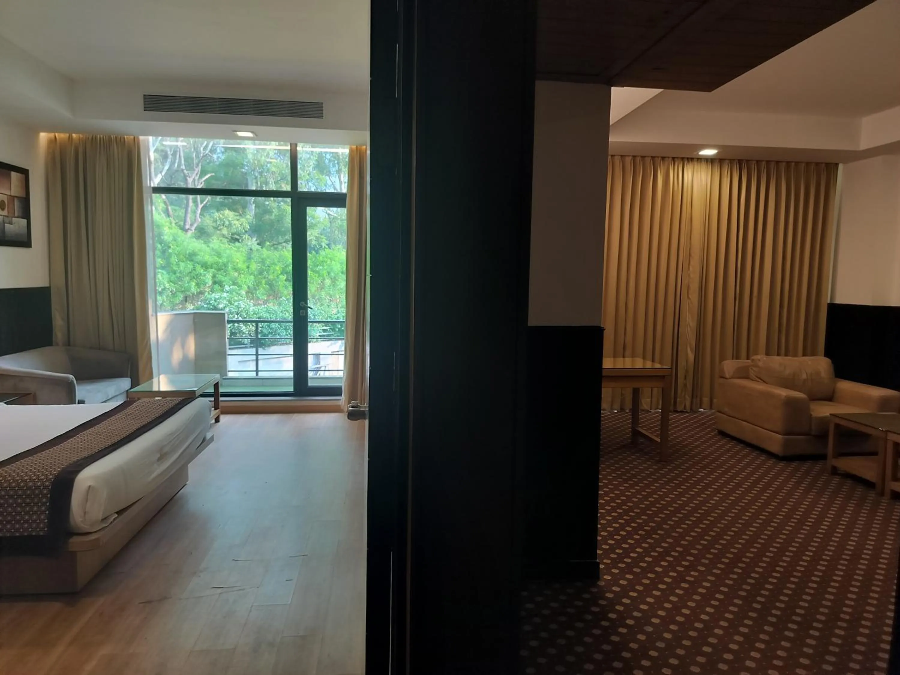 Living room, Bed in Stellar Resorts By Bel-La Monde, Rajokri, Near IGI Airport, Delhi