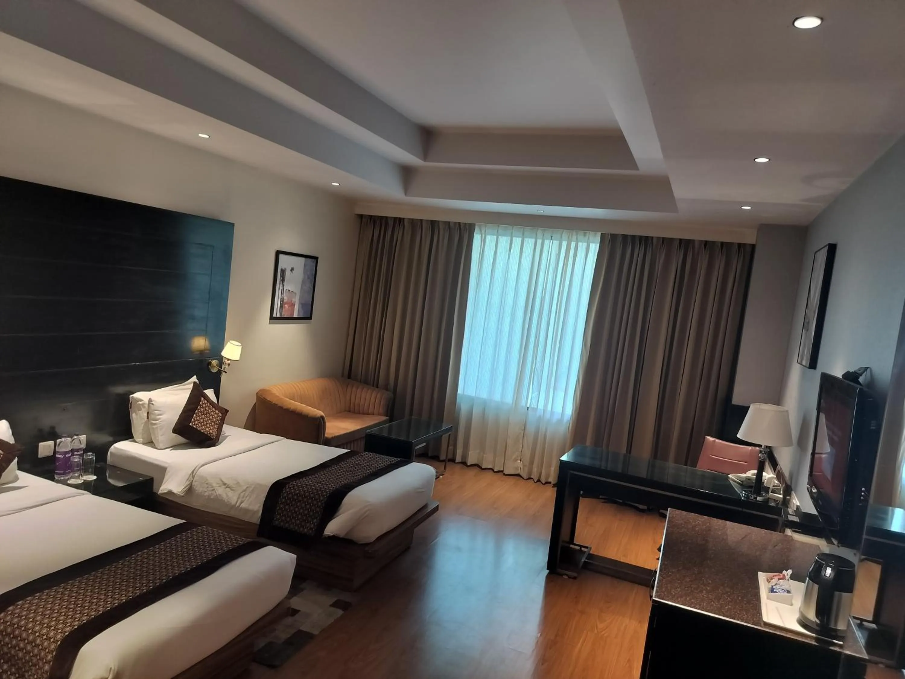 Photo of the whole room, Bed in Stellar Resorts By Bel-La Monde, Rajokri, Near IGI Airport, Delhi