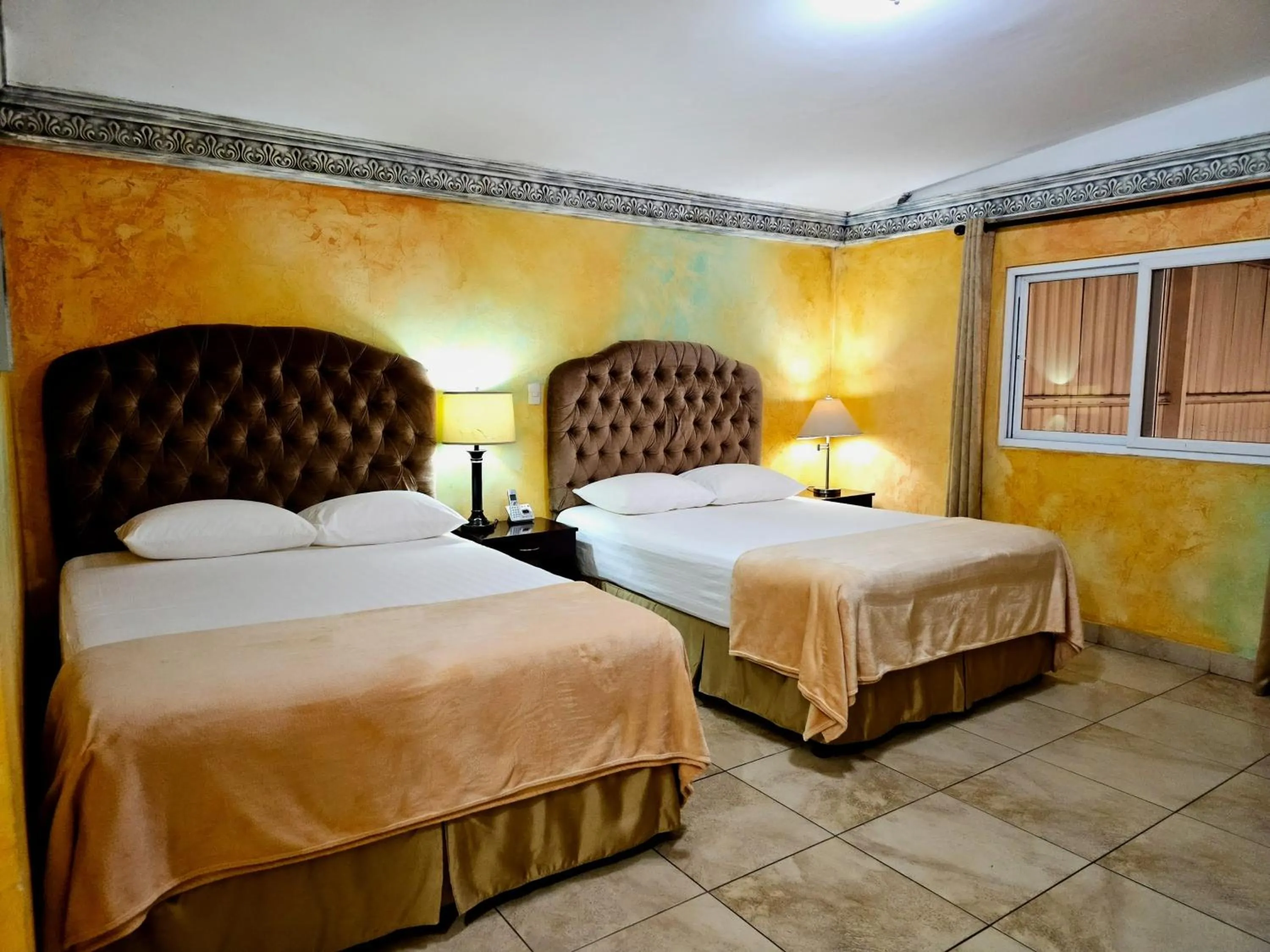 Bed in Antigua Inn Hotel