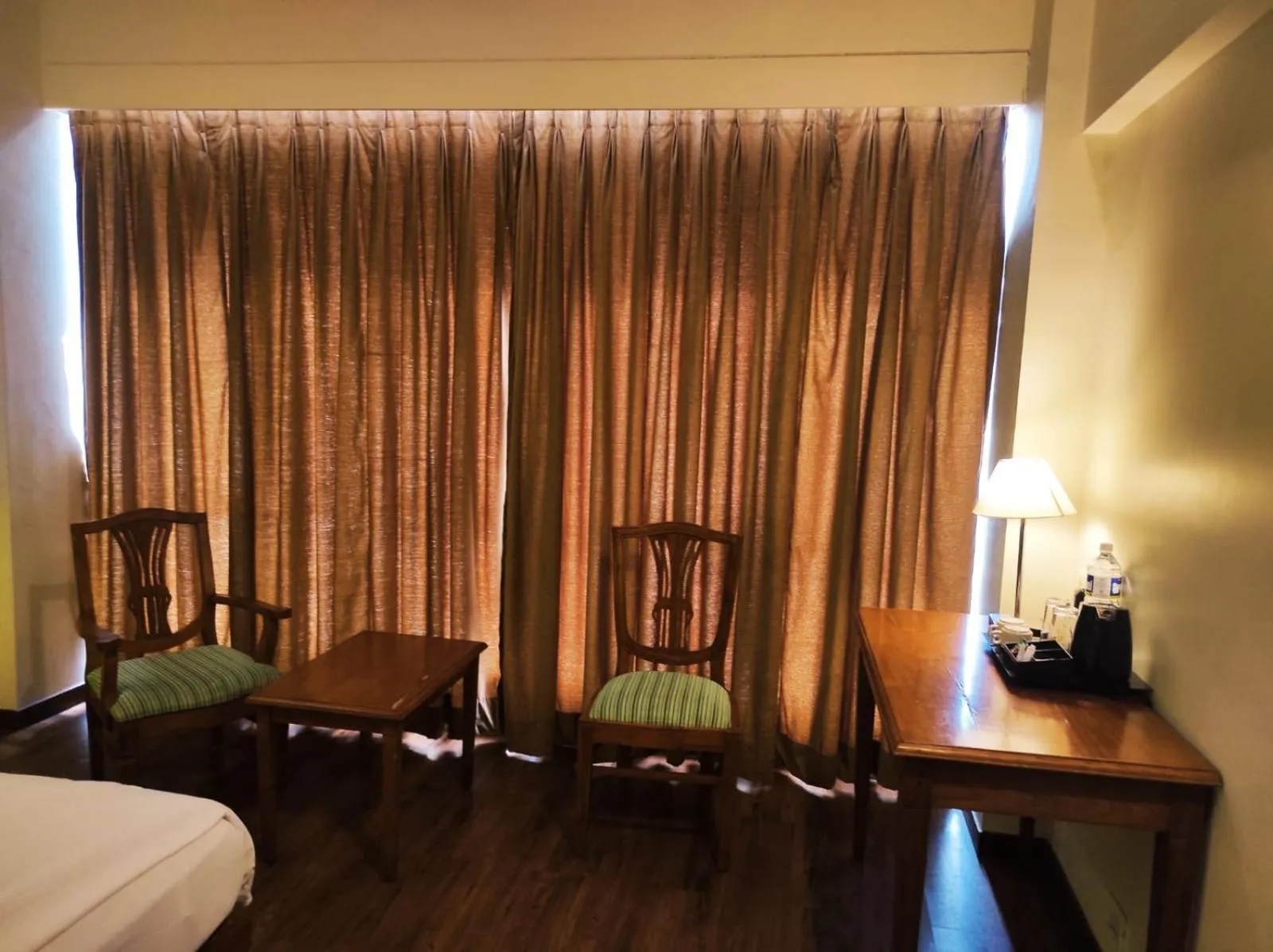 Seating area, Bed in Krishna Inn - Royal Hotels