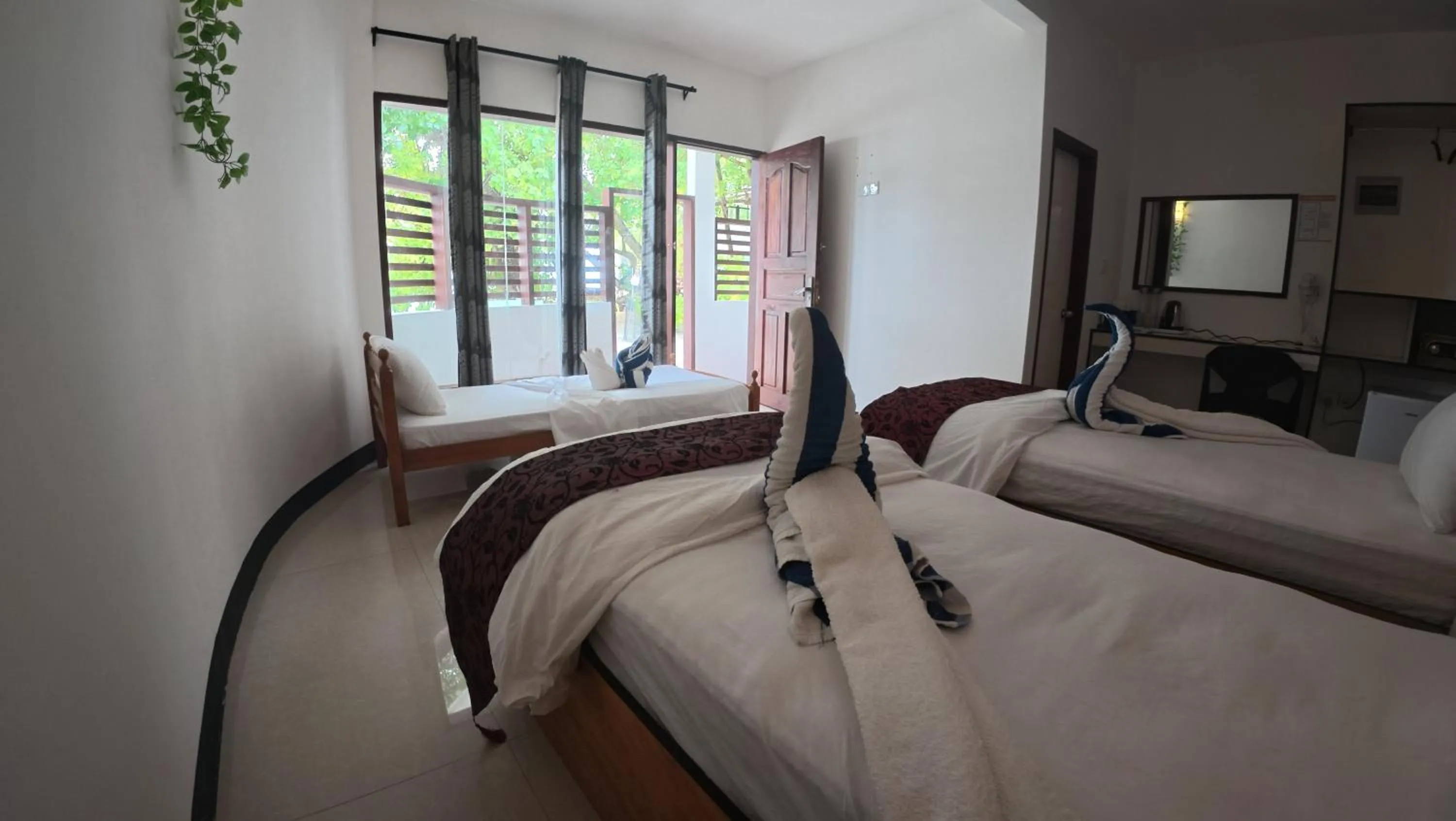 Bed in Liberty Guesthouse Maldives