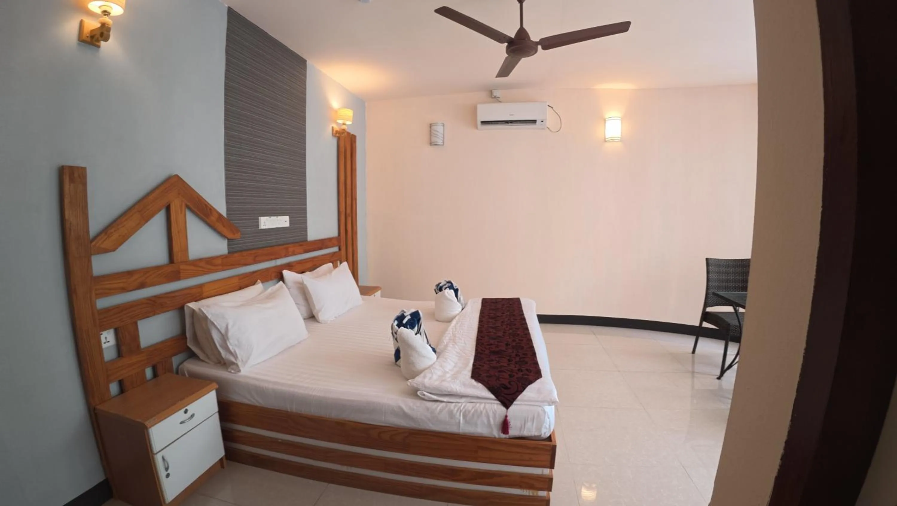 Bed in Liberty Guesthouse Maldives