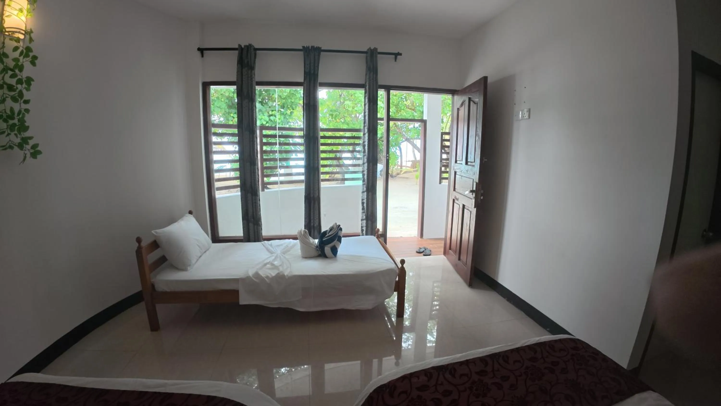 Bed in Liberty Guesthouse Maldives