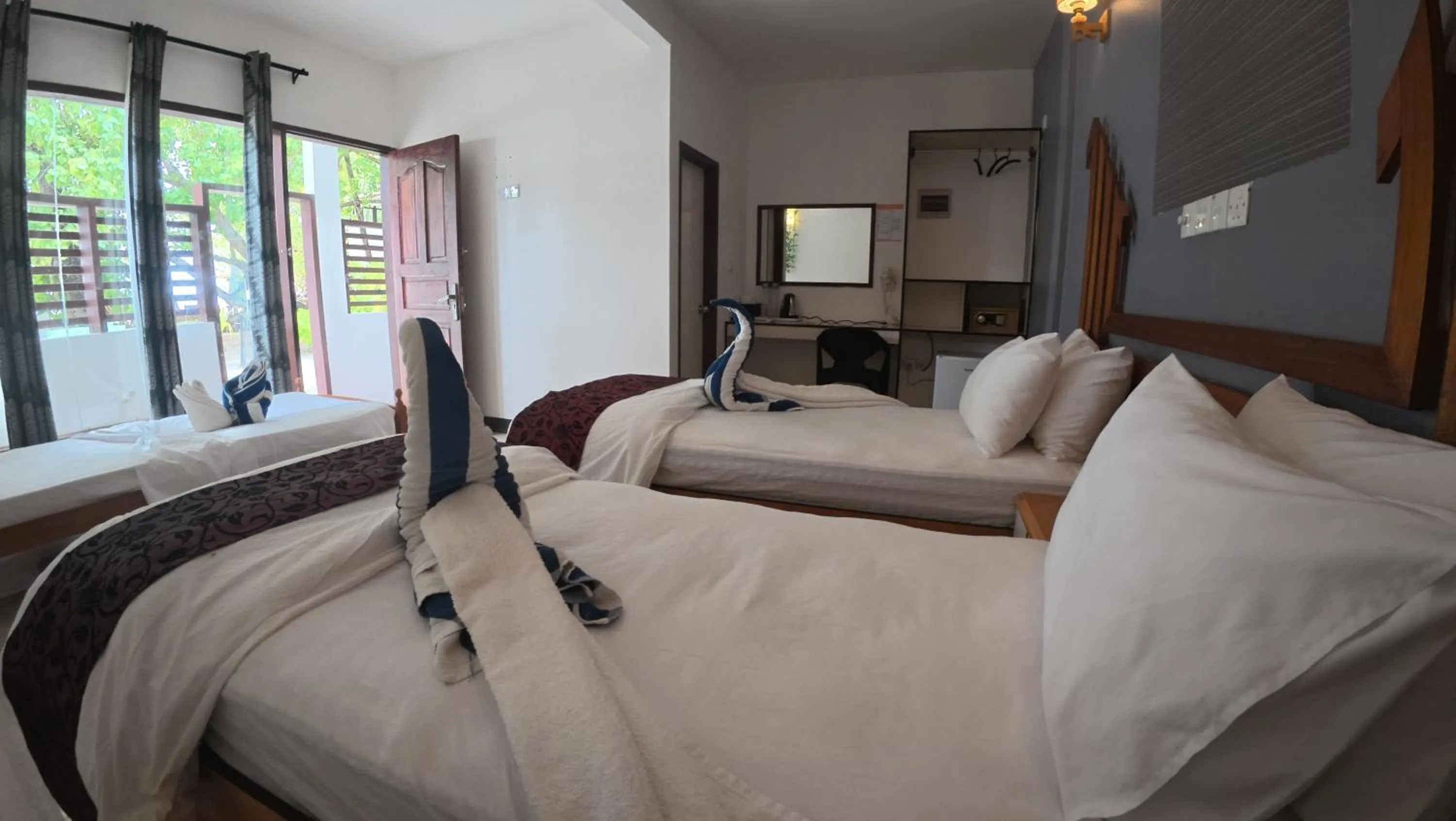 Bed in Liberty Guesthouse Maldives