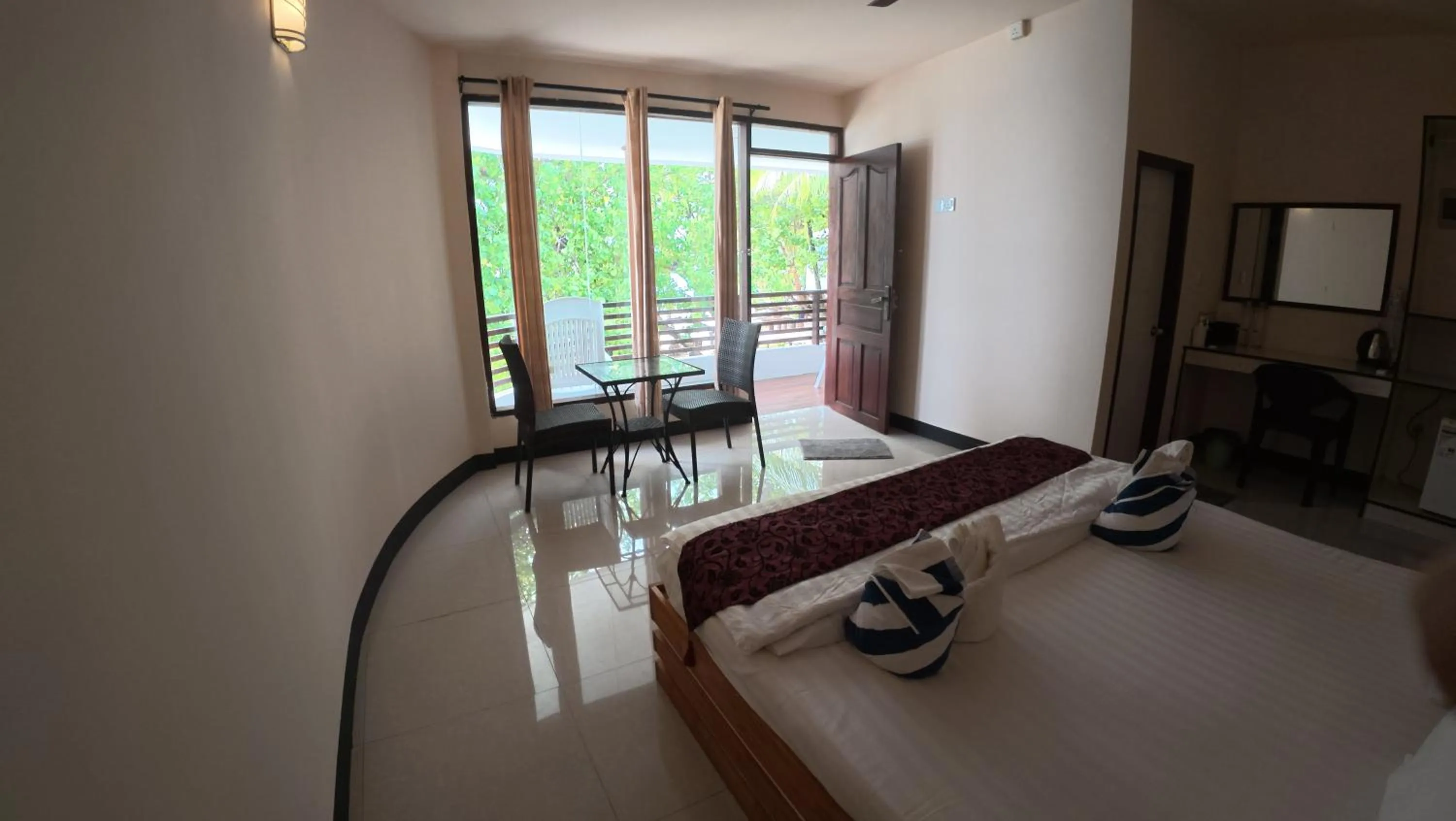 Bed in Liberty Guesthouse Maldives