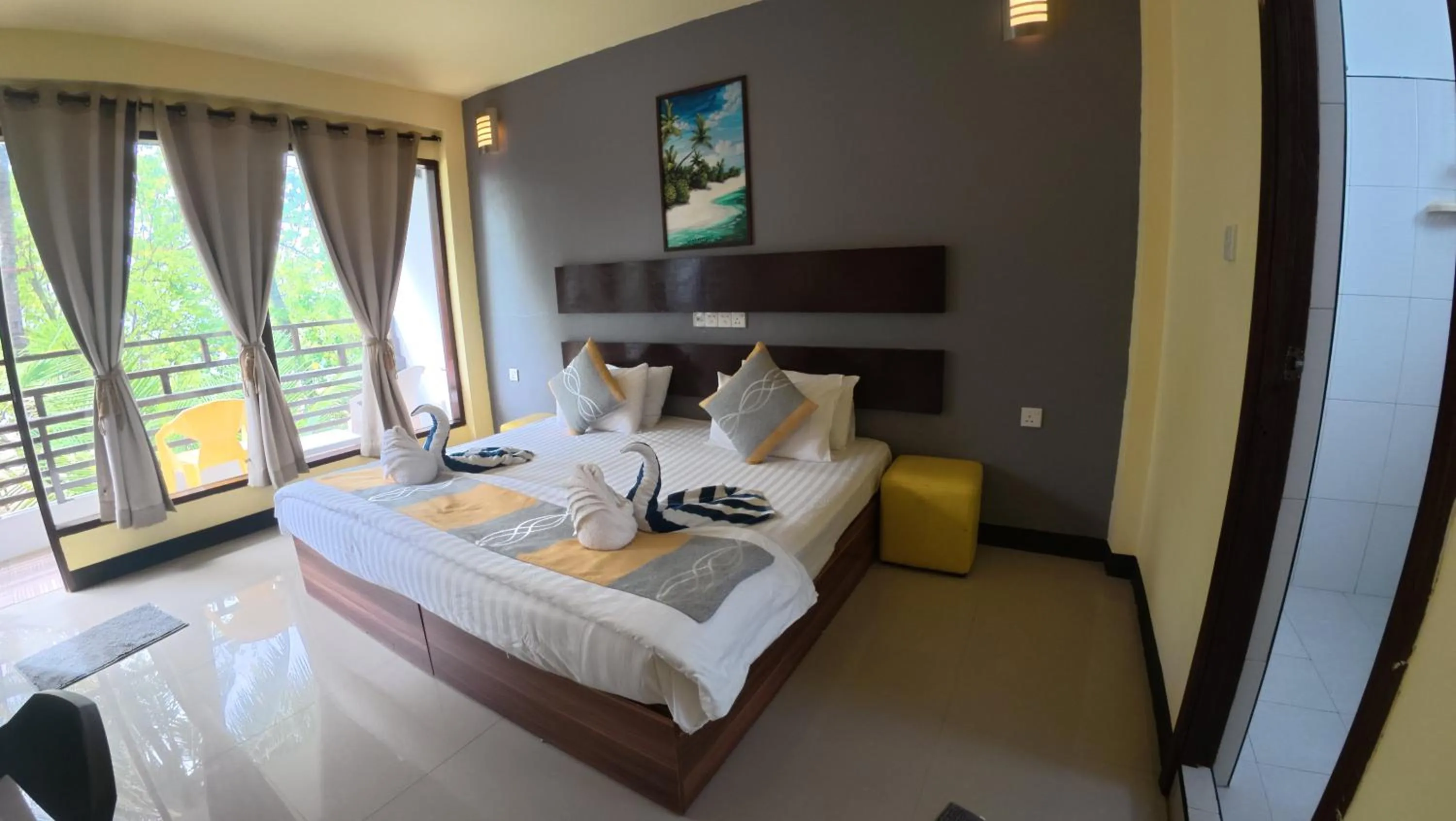 Bed in Liberty Guesthouse Maldives