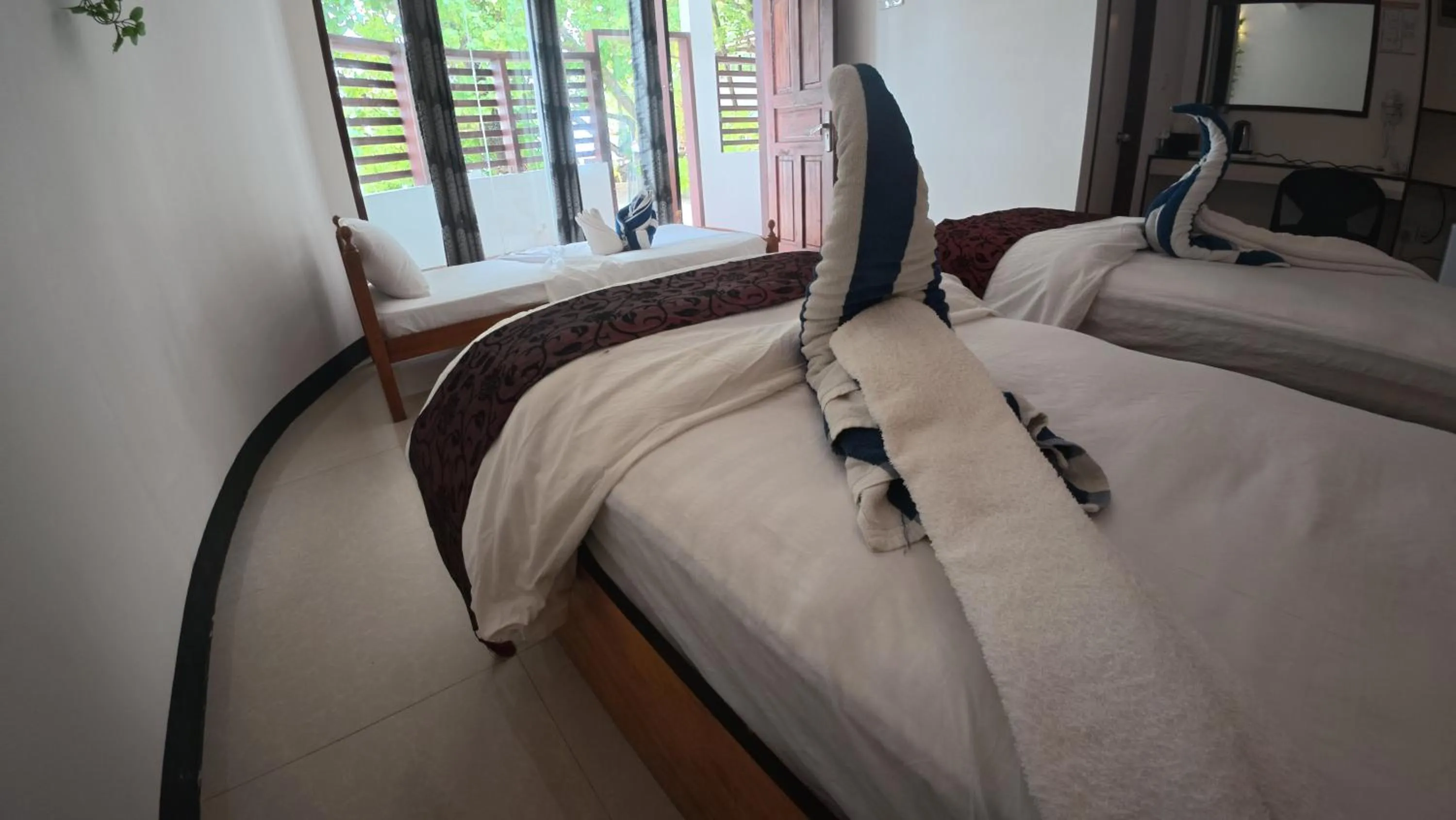 Bed in Liberty Guesthouse Maldives