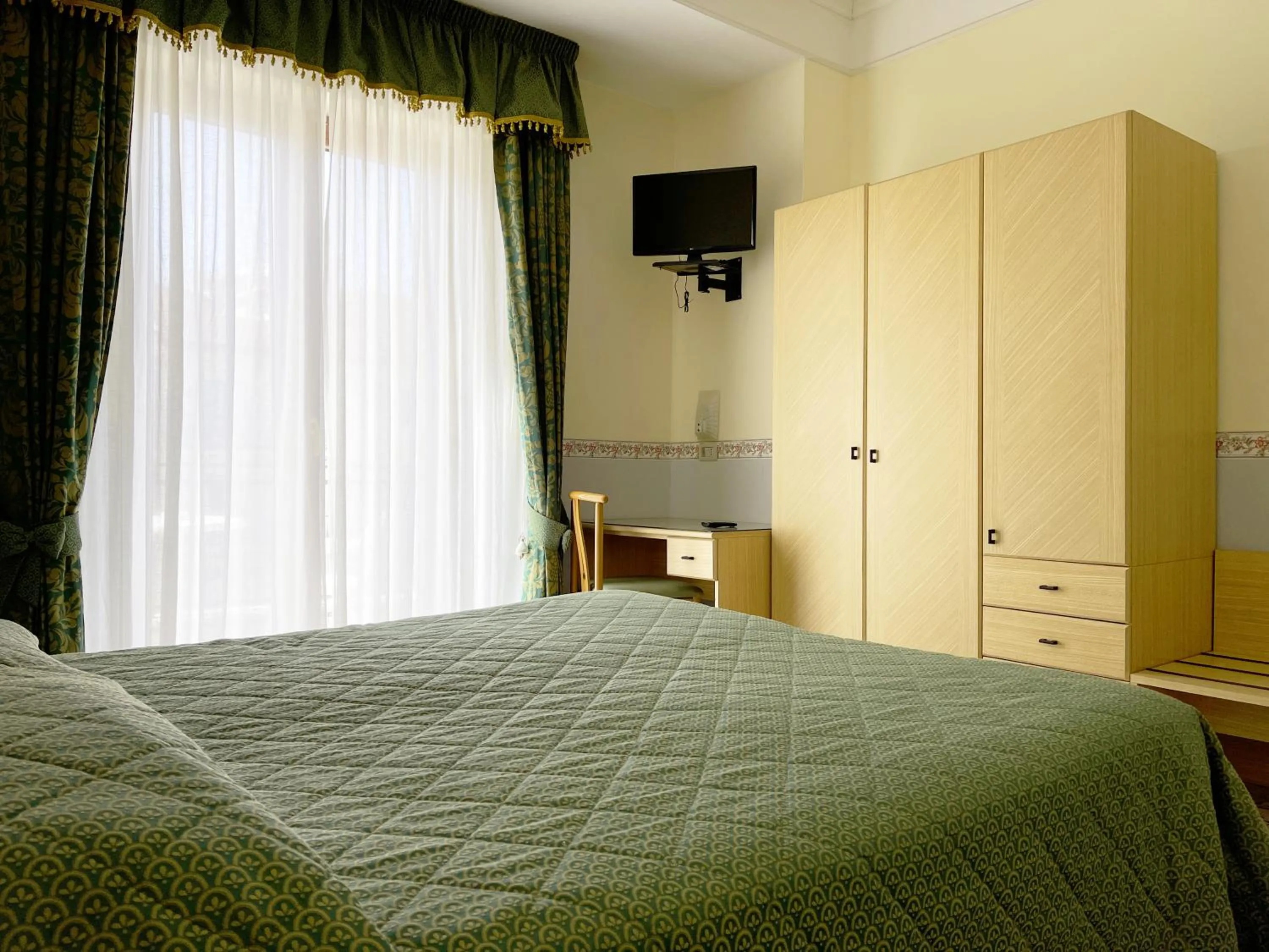 Bed in Hotel Reginella