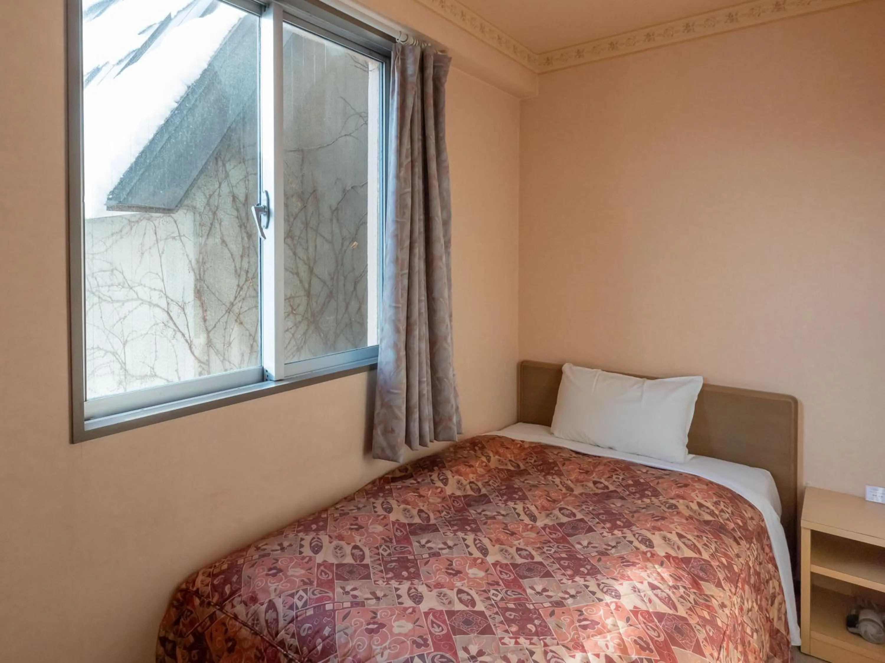 Bed in Tabist Hirosaki Touei Hotel