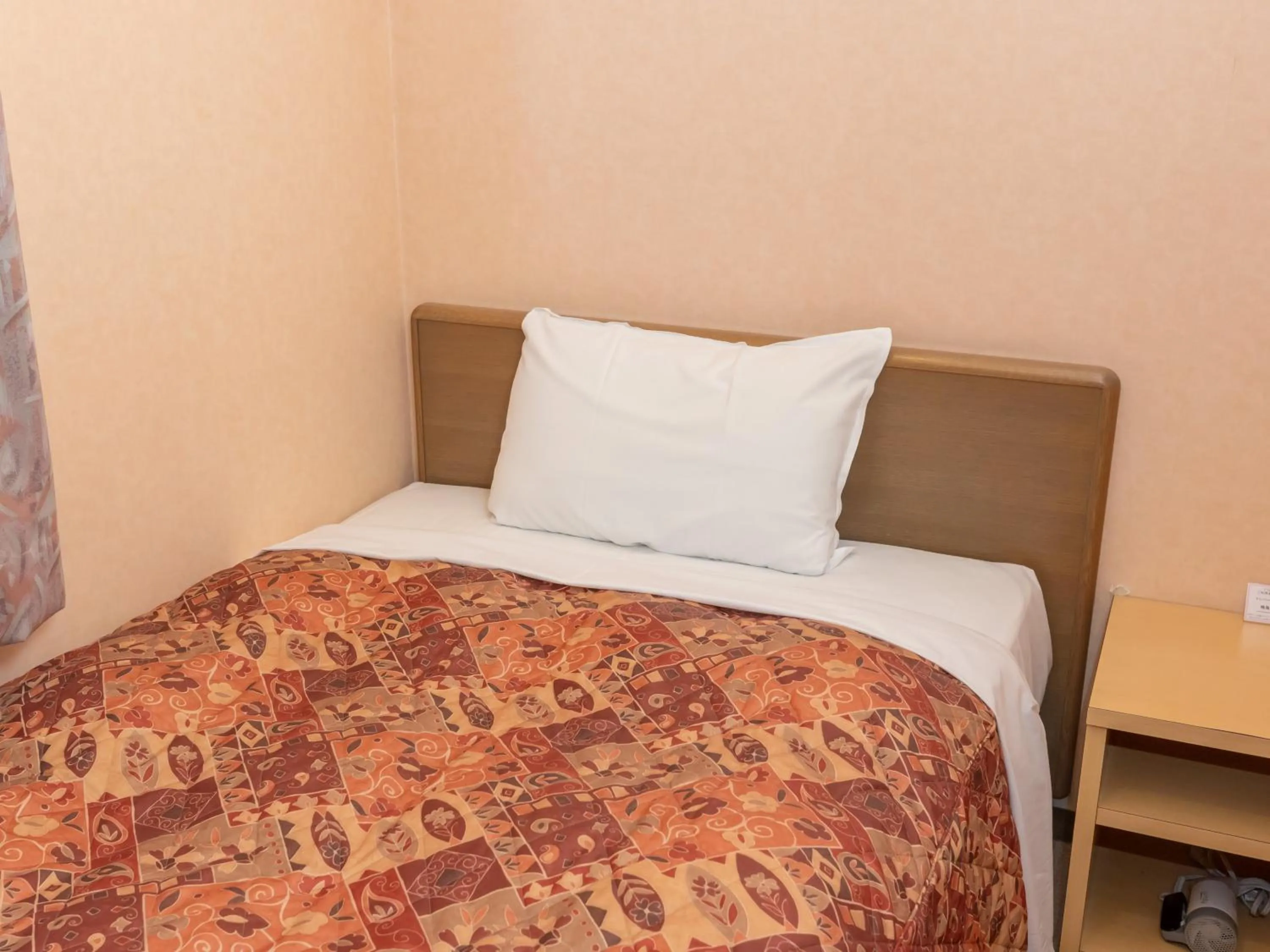 Bed in Tabist Hirosaki Touei Hotel