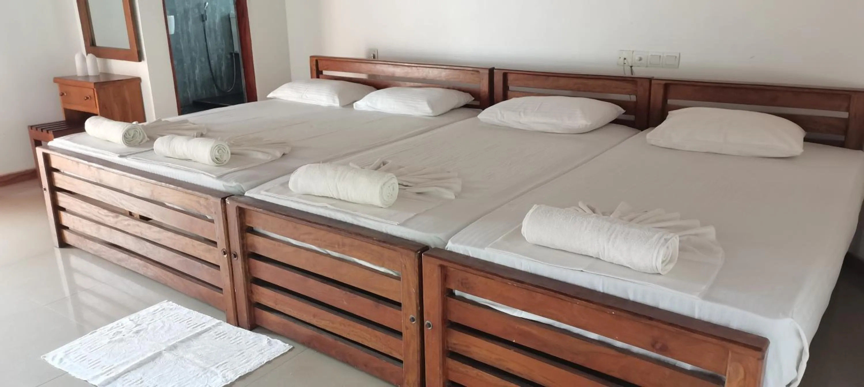 Bed in Rajarata Family Resort