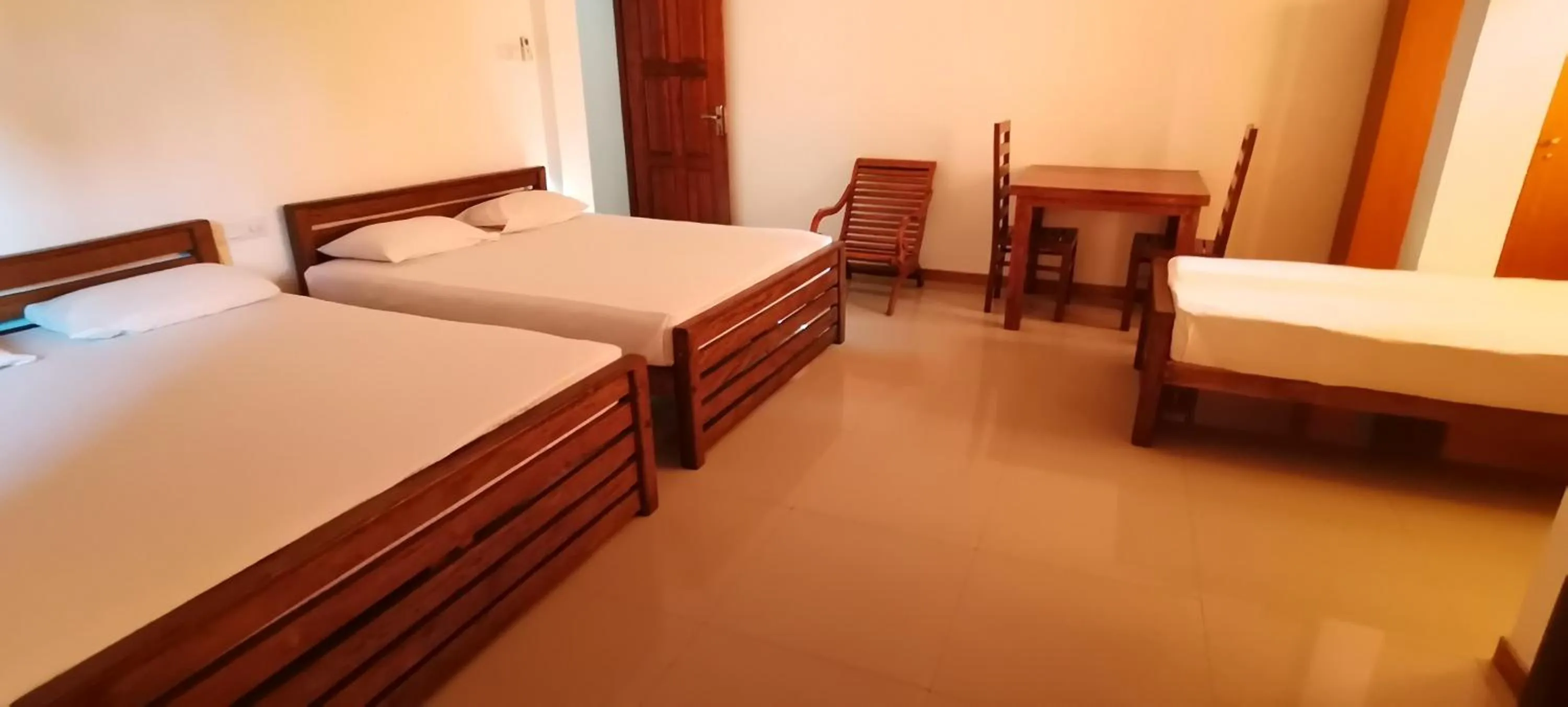 Bed in Rajarata Family Resort