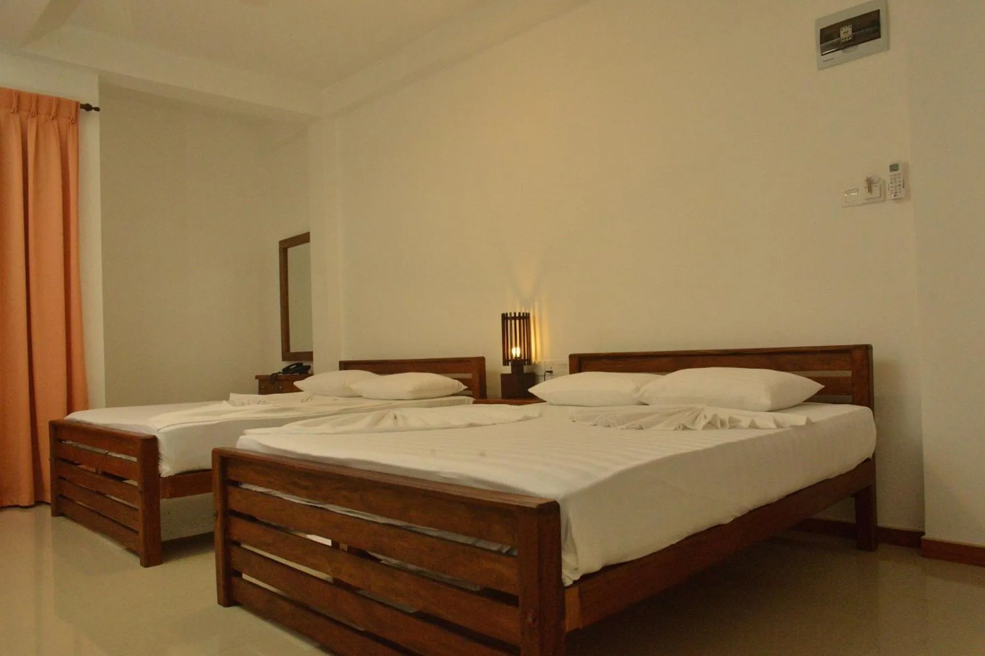 Bed in Rajarata Family Resort