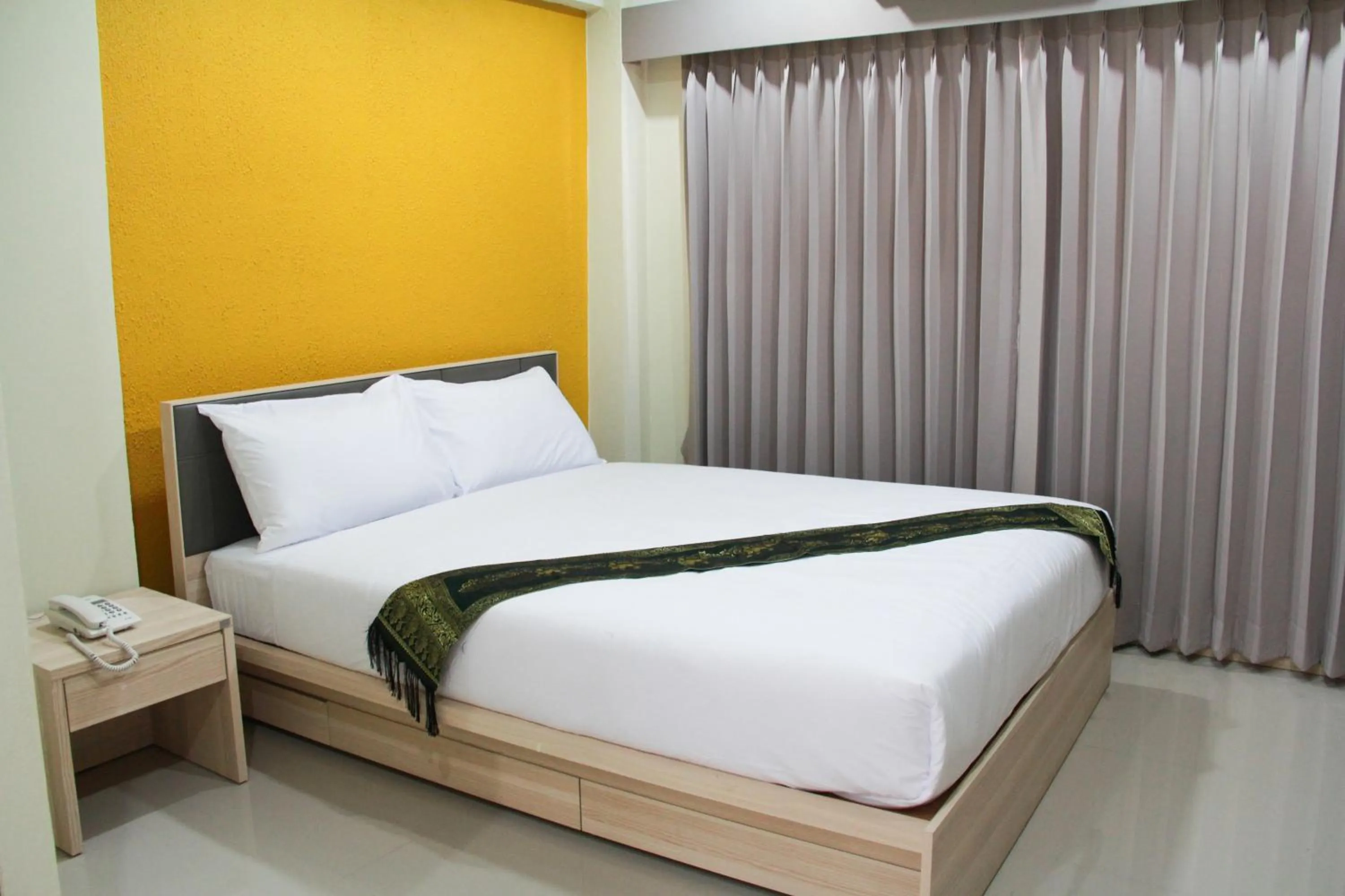 Bed in La Porte Hotel Bangkok