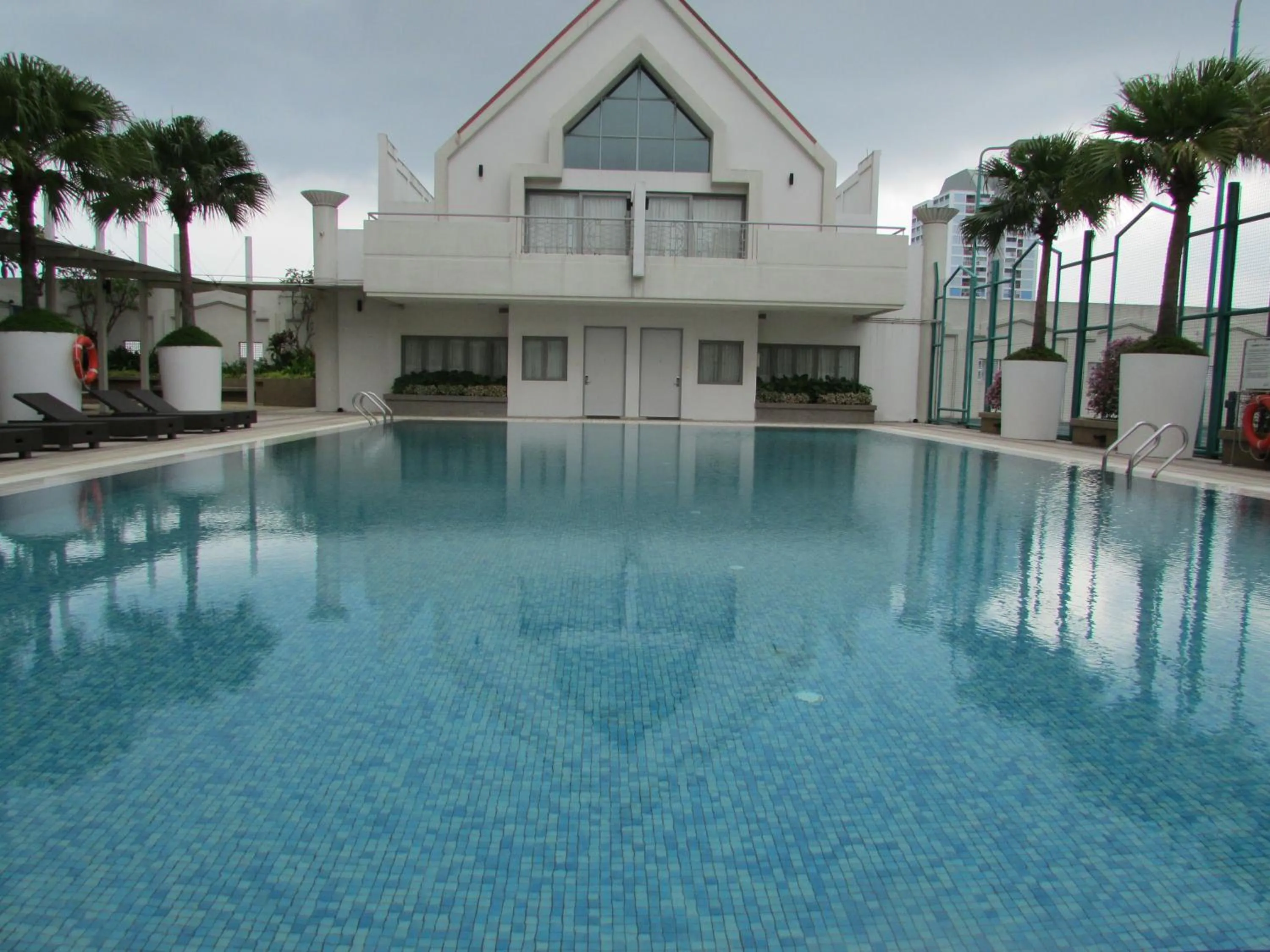 Swimming pool in Village Residence West Coast by Far East Hospitality