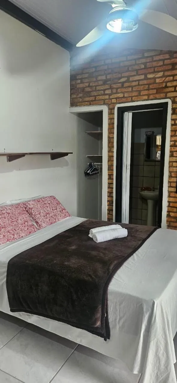 Bed in Pousada Marujo