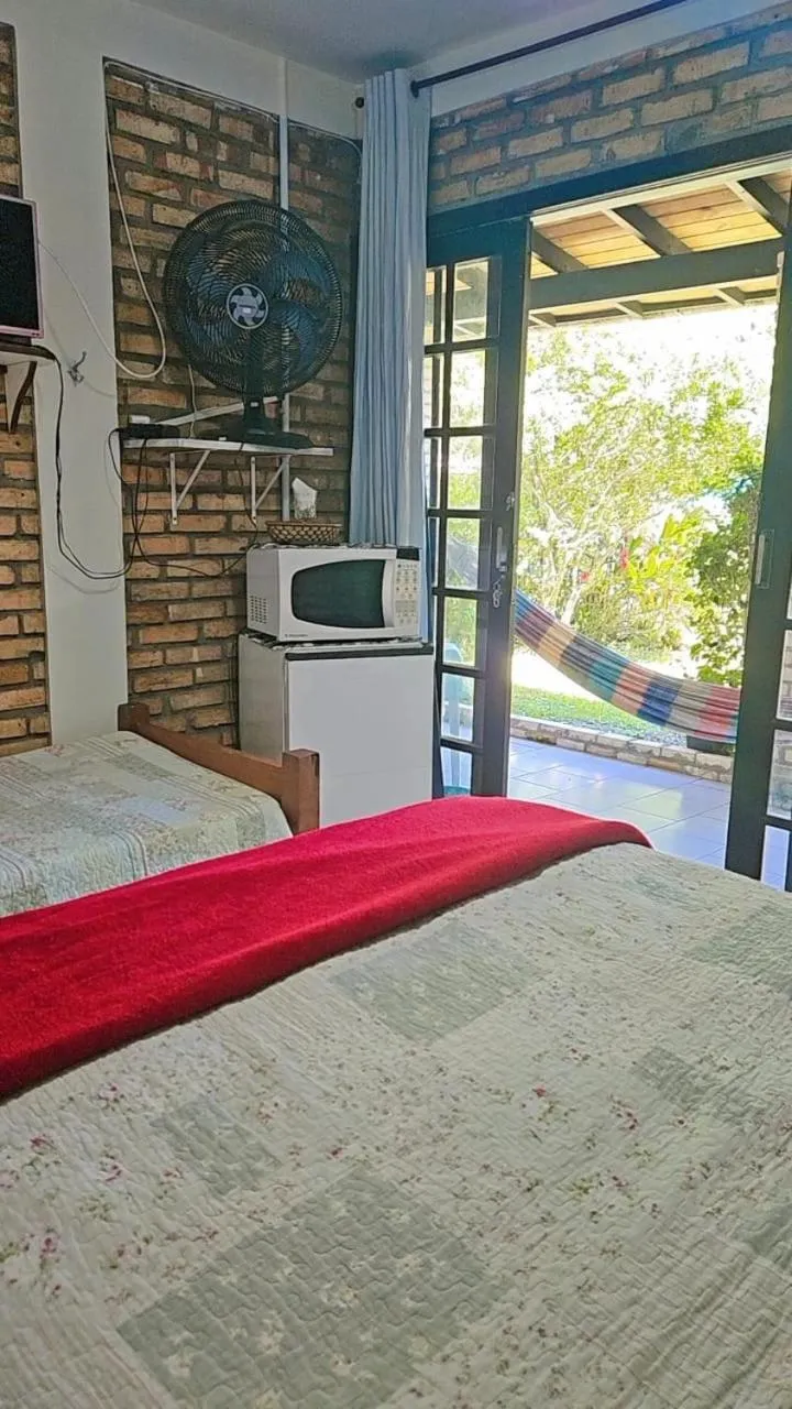 Bed in Pousada Marujo