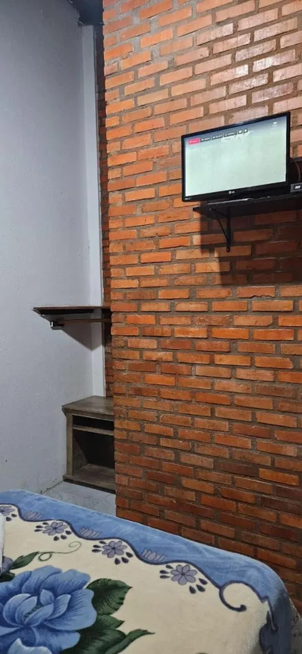 Bed in Pousada Marujo