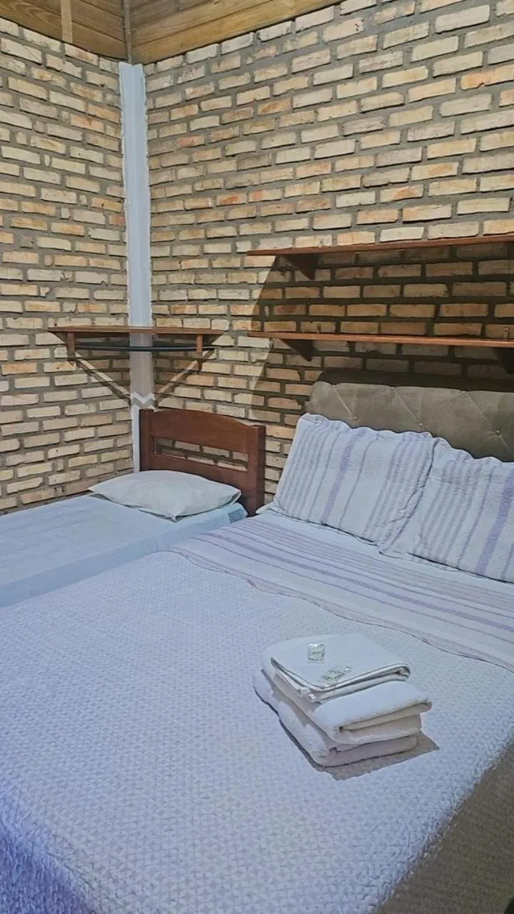 Bed in Pousada Marujo