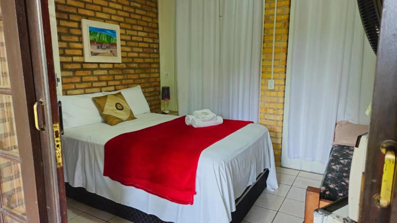 Bed in Pousada Marujo