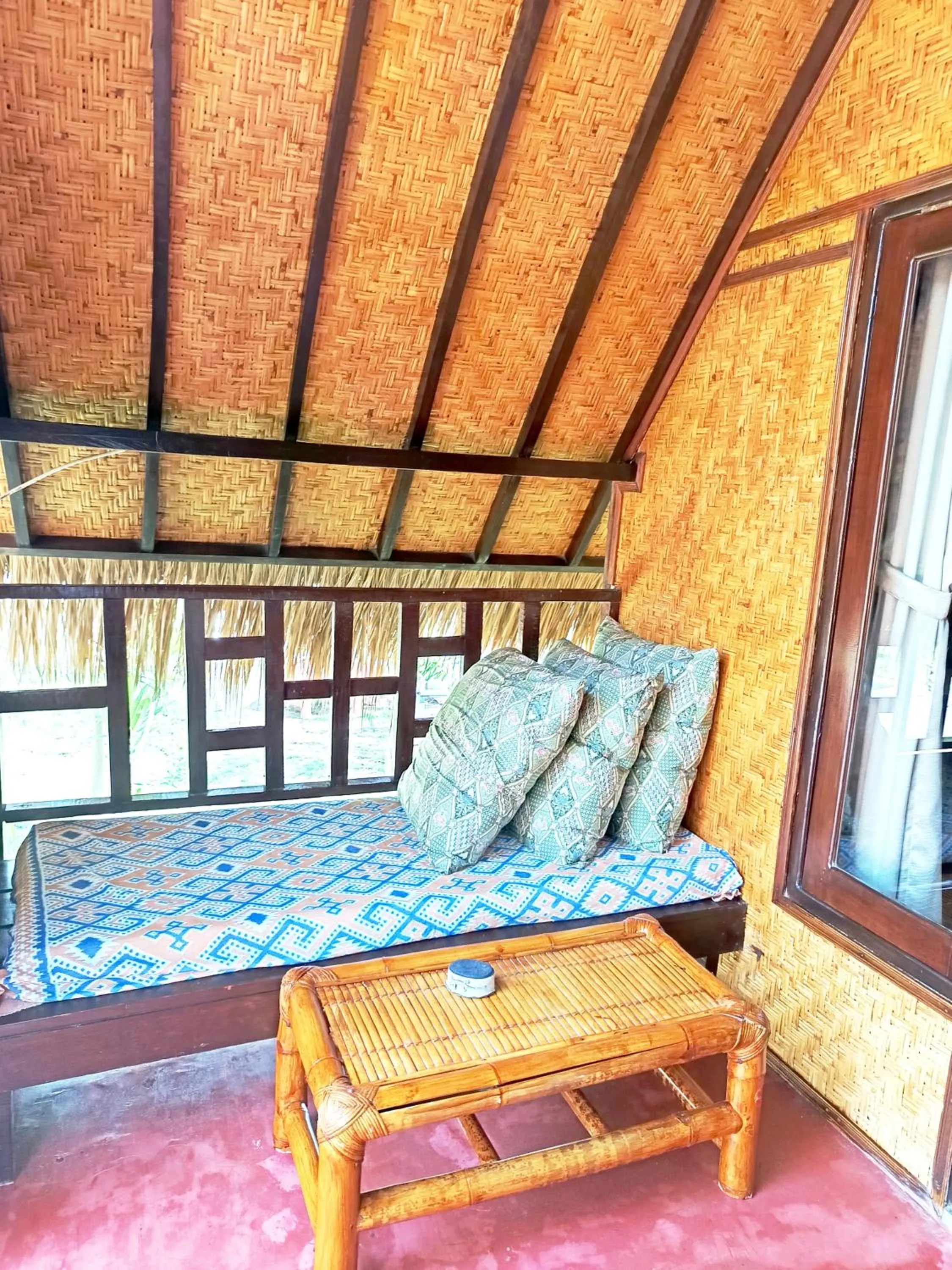 Seating area in Kampung Meno Bungalows